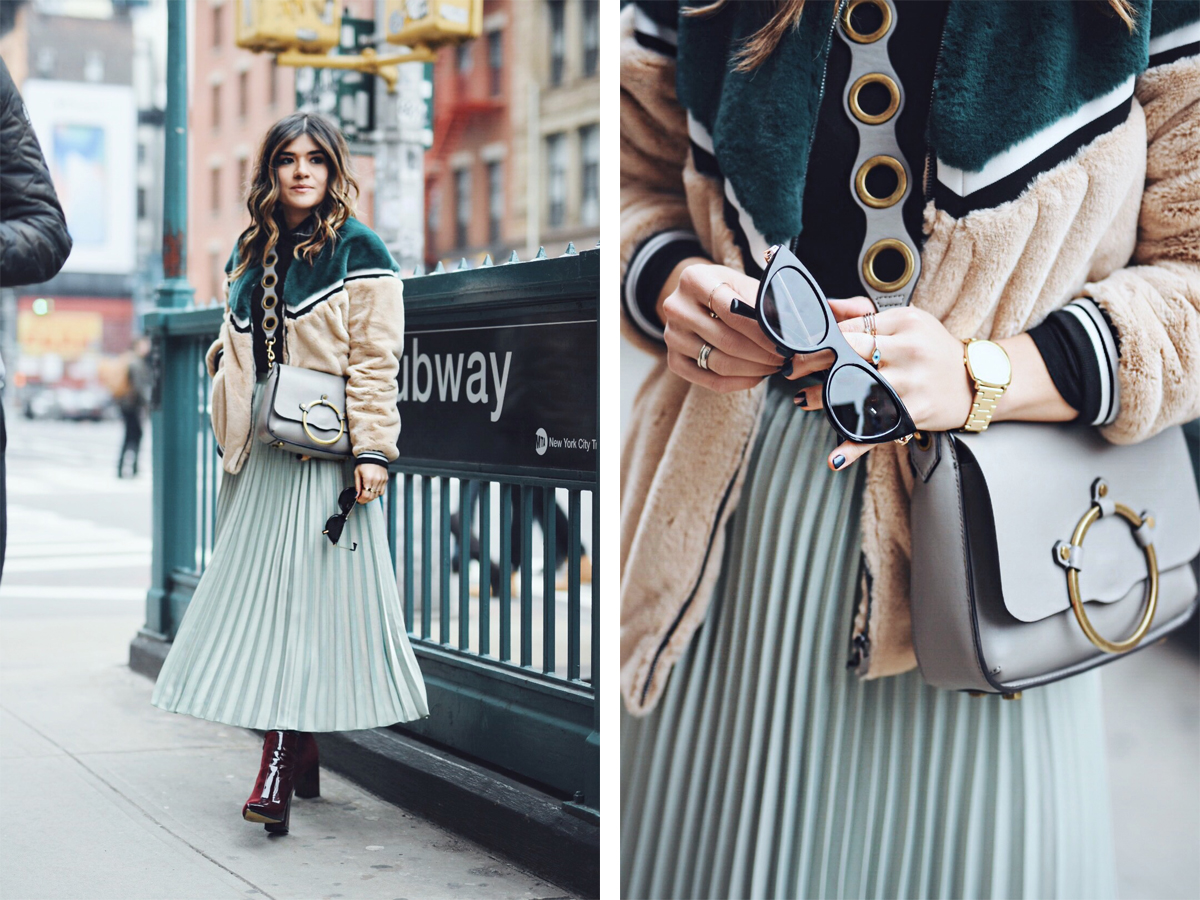 Carolina Hellal of Chic Talk wearing an H&M pleated skirt, Shein bomber jacket, Public Desire boots and Rebecca Minkoff bag - NYFW 2018 DAY 2 AND 3 by popular Denver fashion blogger Chic Talk