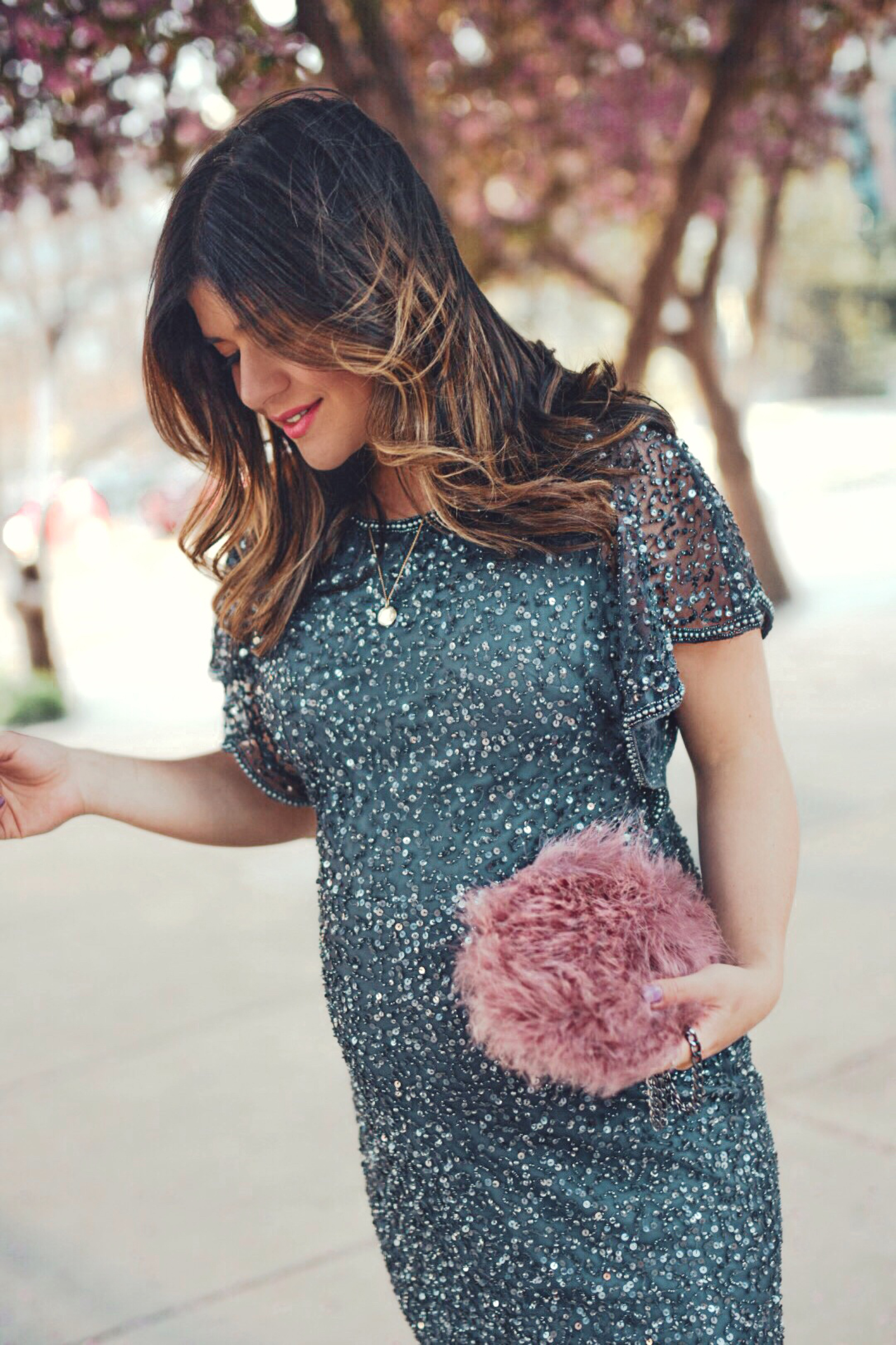 Carolina Hellal of Chic Talk wearing an Adrianna Papell beaded cocktail dress, Nine west grey shoes and topshop feather bag - ADRIANNA PAPELL DRESS styled by popular Denver fashion blogger, Chic Talk