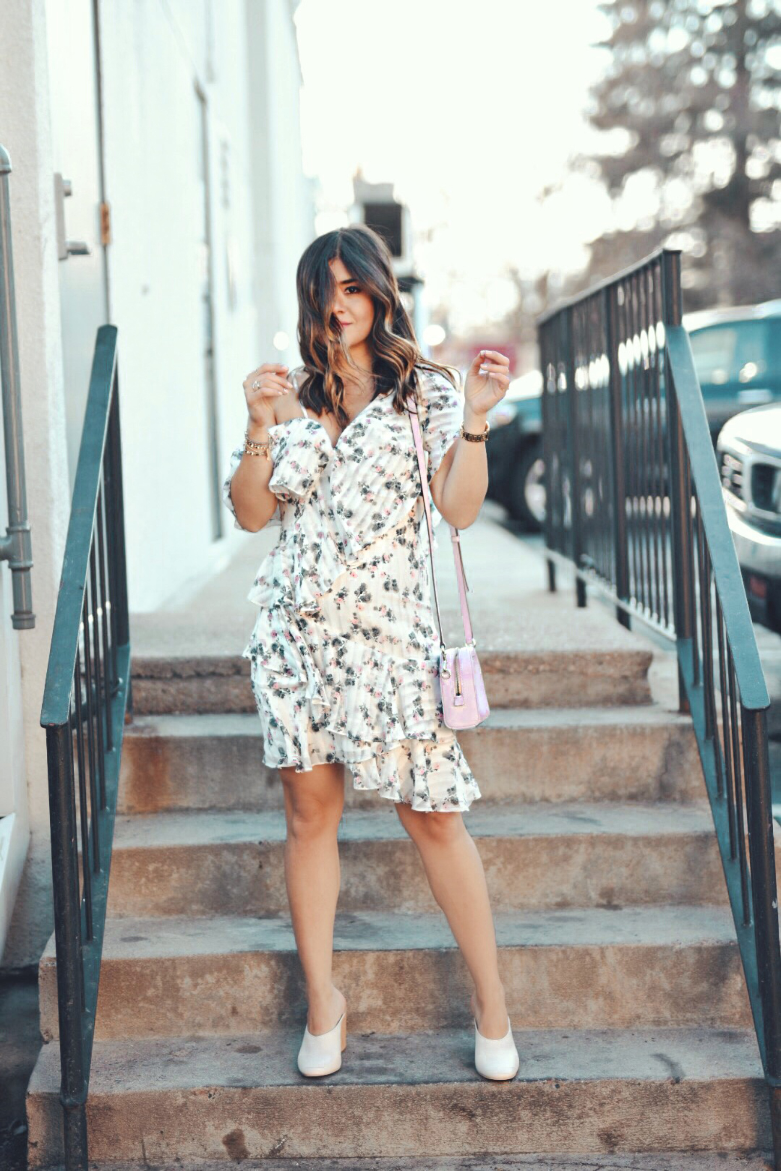 Carolina Hellal of Chic Talk sytling a floral dress via Nordstrom, Dolce Vita white mules, baby pink Marc Jacobs bag and watch and Bauble Bar gold necklace. - THE FLIRTY FLORAL DRESS styled by Denver fashion blogger Chic Talk