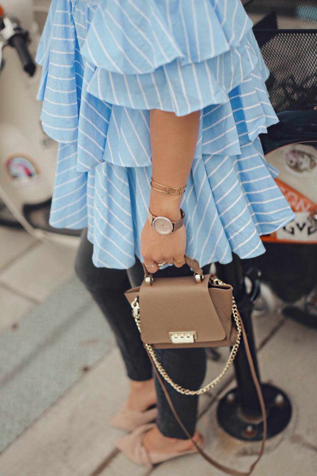 Carolina Hellal of Chic Talk wearing a Chicwish striped off the shoulder top, H&M maternity jeans, Zac Posen bag and Sam Edelman slides