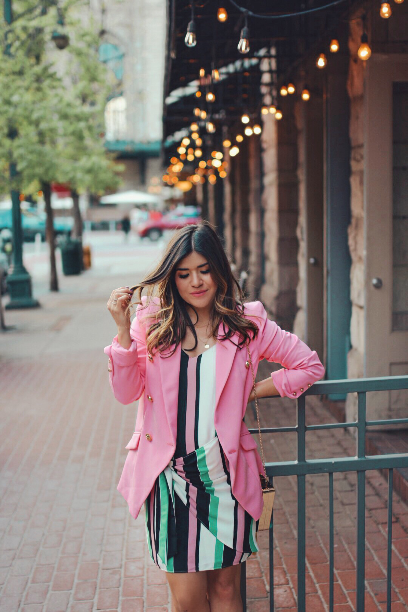 Carolina Hellal of Chic Talk wearing a River Island prink blazer, striped dress and green embellished clutch - THE ULTIMATE SPRING SHOPPING GUIDE by popular Denver fashion blogger, Chic Talk