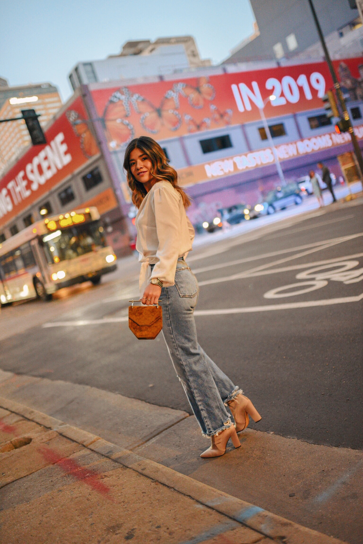 Carolina Hellal of Chic Talk wearing a silk wrap top and wide leg jeans from Abercrombie, M2Malletier bag and nude ankle boots.