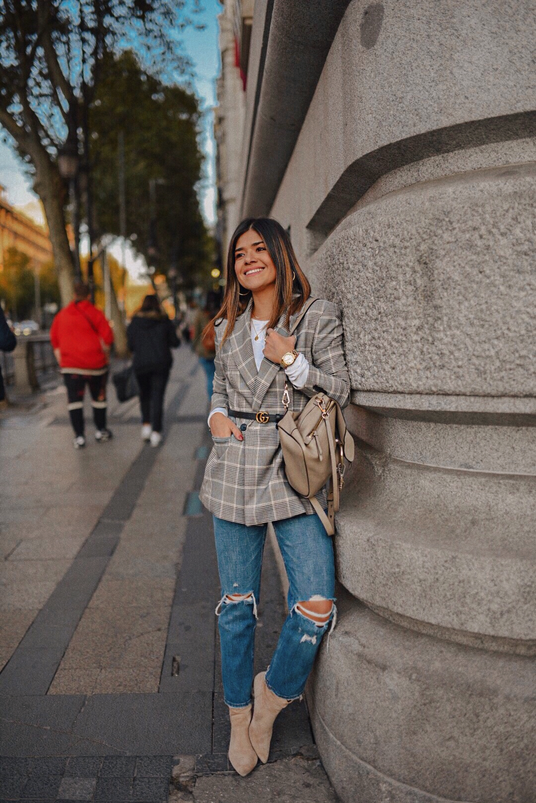 Carolina Hellal of Chic Talk wearing an H&M plaid blazer, white crew sweater, Abercrombie jeans, Chloé backpack and Gucci belt.
