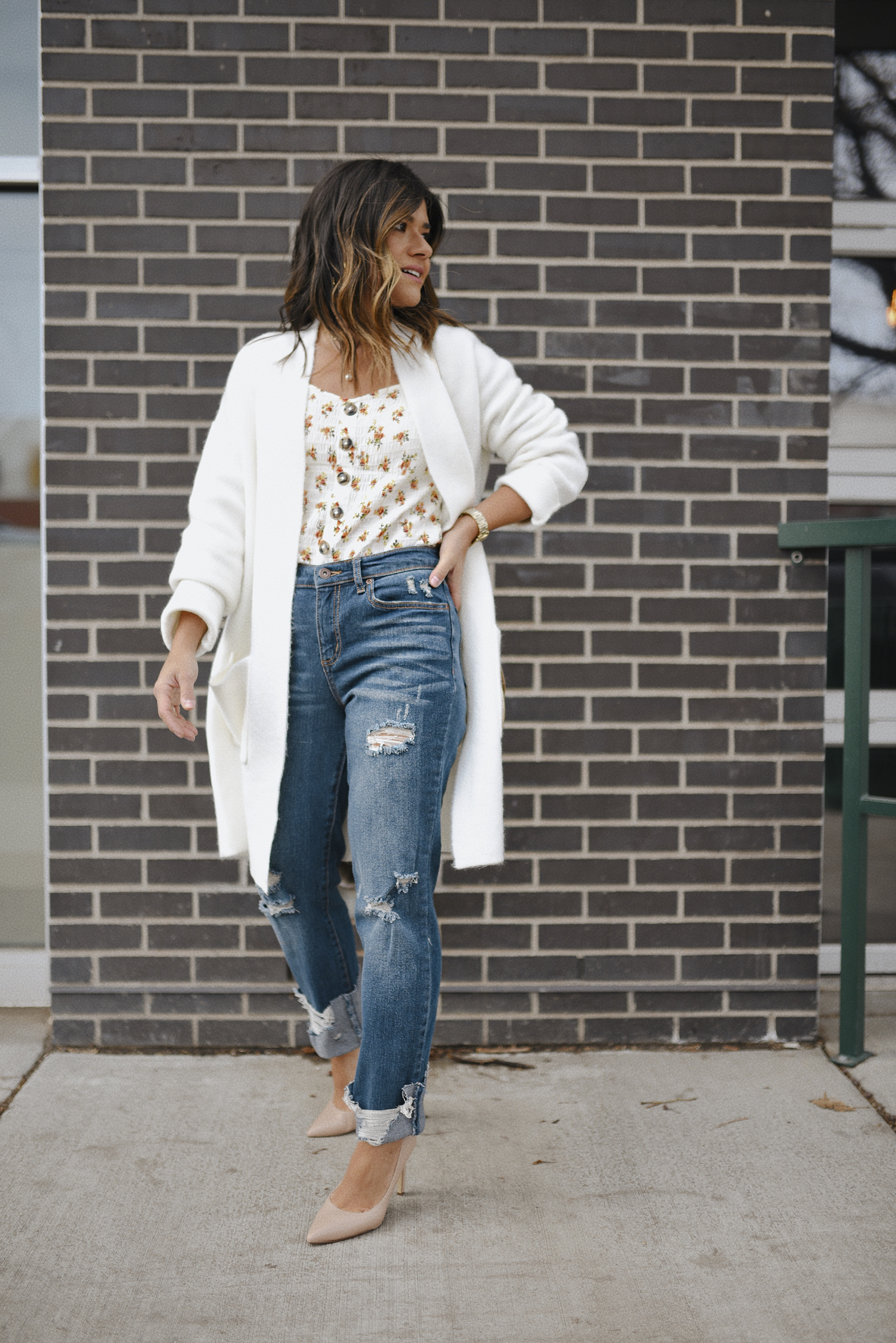 Carolina Hellal of Chic Talk wearing Sofia Jeans via Walmart , floral blouse and Time & Tru white long cardigan. 