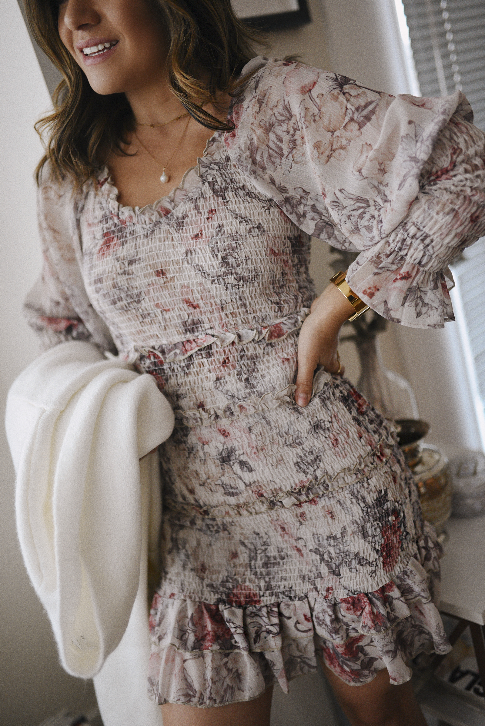 Carolina Hellal of Chic Talk wearing a floral mini dress via Nordstrom and Marc Fisher grey booties