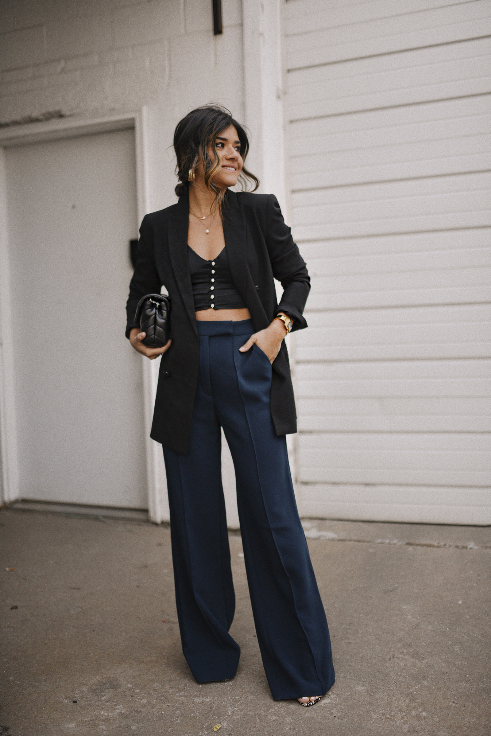 Carolina Hellal of Chic Talk wearing topshop navy blue trousers, Zara black crop top, H&M black blazer and YSL black crossbody bag. 