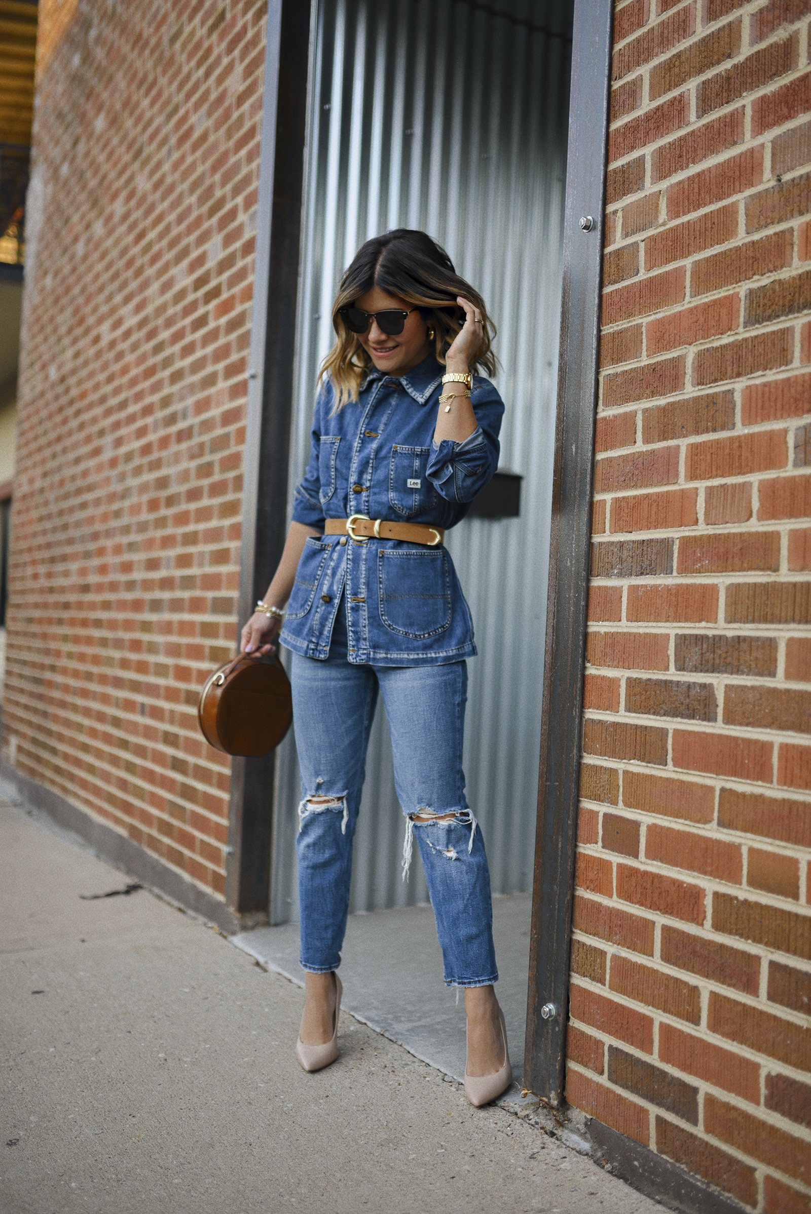 Carolina Hellal of Chic Talk wearing a denim jacket by Lee, Abercrombie straight leg jeans and Sam Edelman nude pumps. 