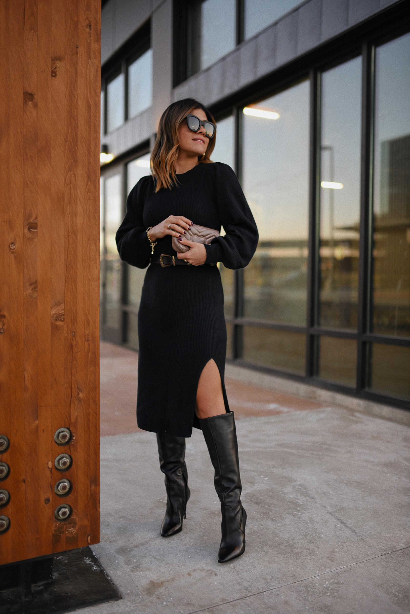 Carolina Hellal of Chic Talk wearing an Abercrombie Knit sweater dress, Vince Camuto Tall Black boots, QUAY sunglasses and Gucci crossbody bag.