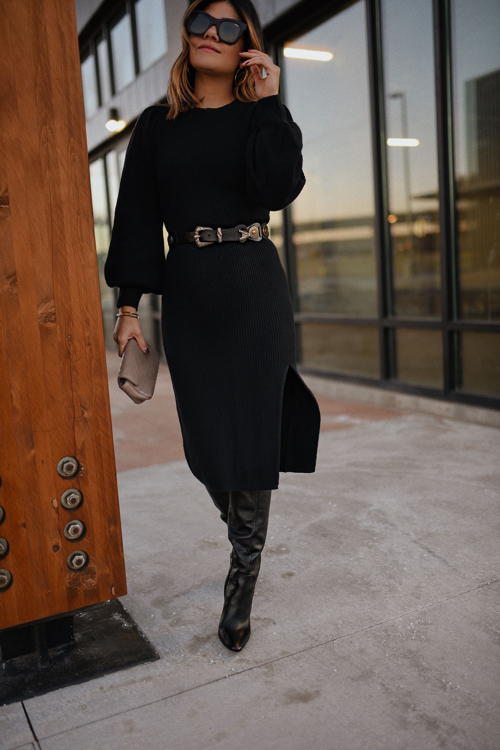 Carolina Hellal of Chic Talk wearing an Abercrombie Knit sweater dress, Vince Camuto Tall Black boots, QUAY sunglasses and Gucci crossbody bag.