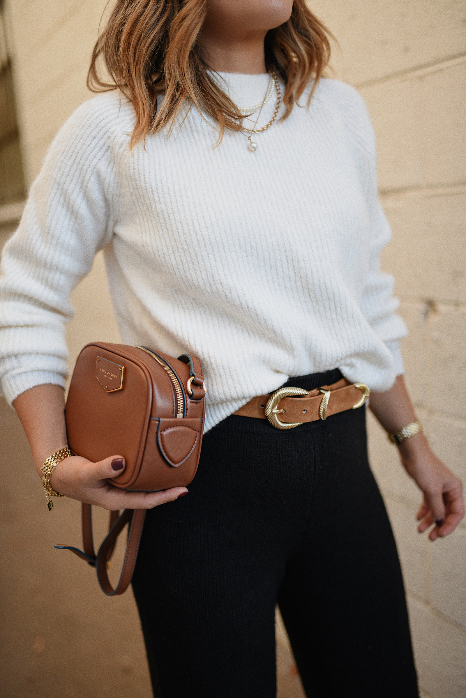 Carolina Hellal of Chic Talk wearing a Marc & Spencer white knit sweater, Express knit wide leg pants ,Steve Madden suede pumps and Marc Jacobs crossbody bag.