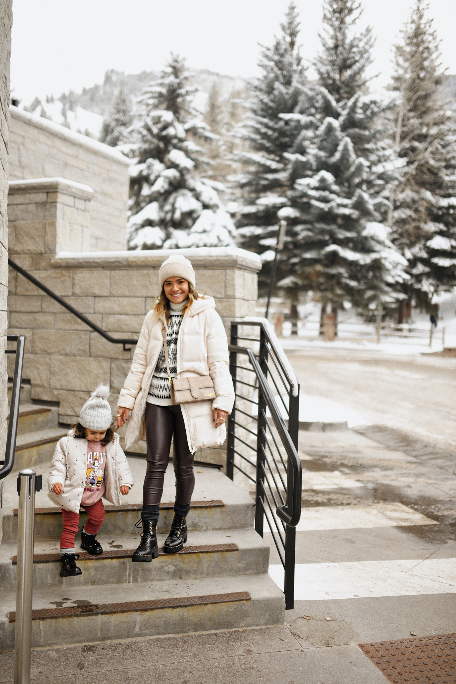 Carolina Hellal and her daughter Sofia at the W Aspen wearing winter outfits with puffer coats and combat boots. 