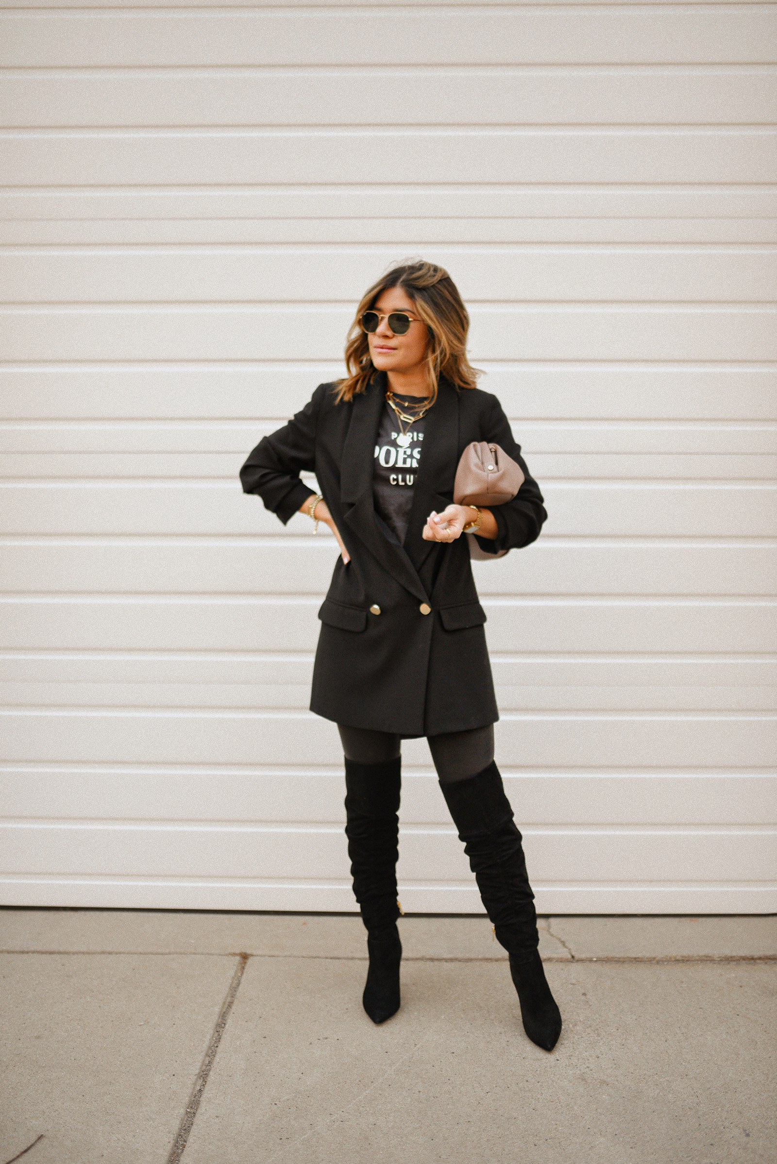 Carolina Hellal of Chic Talk wearing a total black look with an H&M blazer and t-shirt, spanx leggings, Target bag and Vince Camuto over the knee boots. 