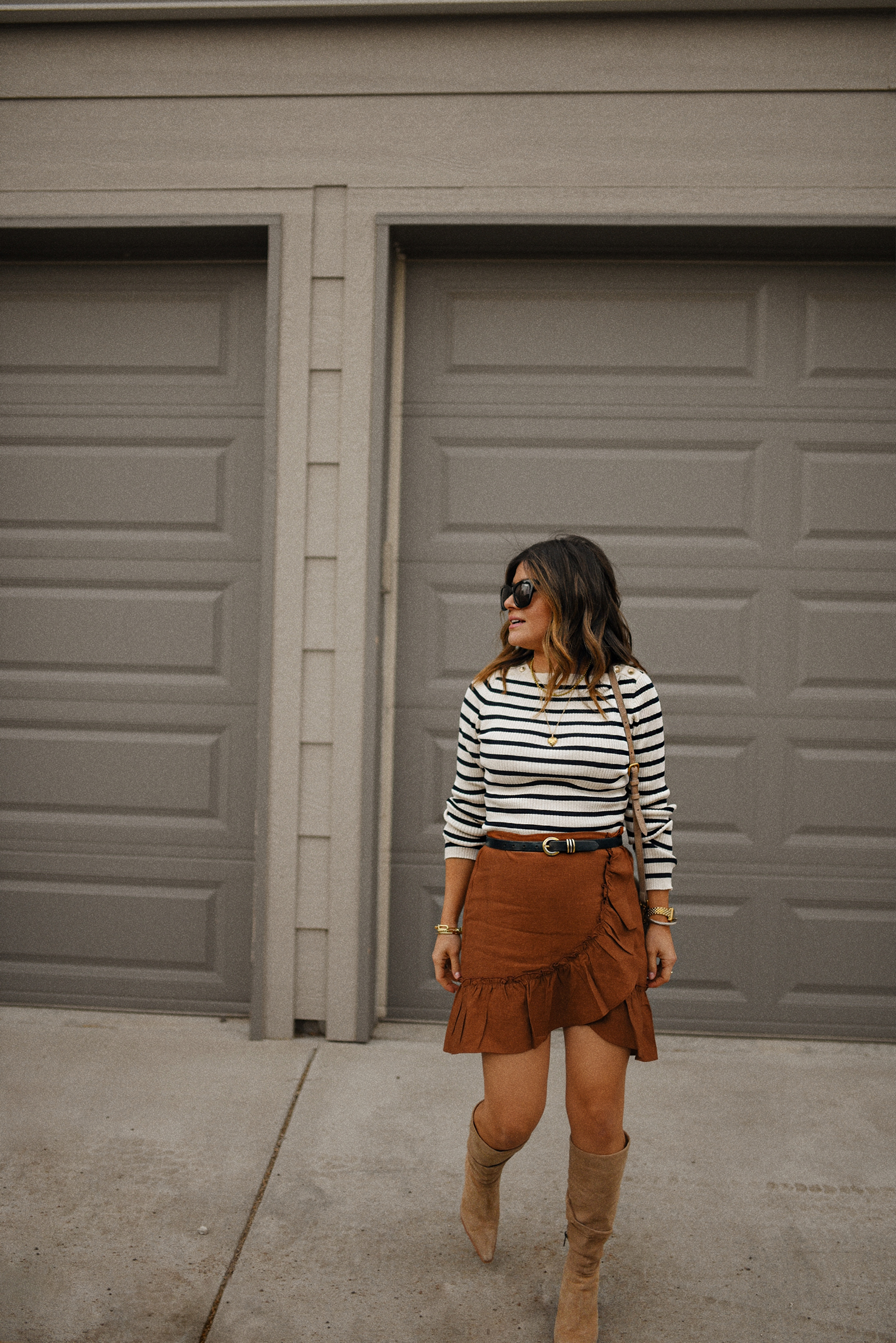 Carolina Hellal of Chic talk wearing an h&m striped nautical sweater, express wrap mini skirt and vince camuto tall suede boots. 