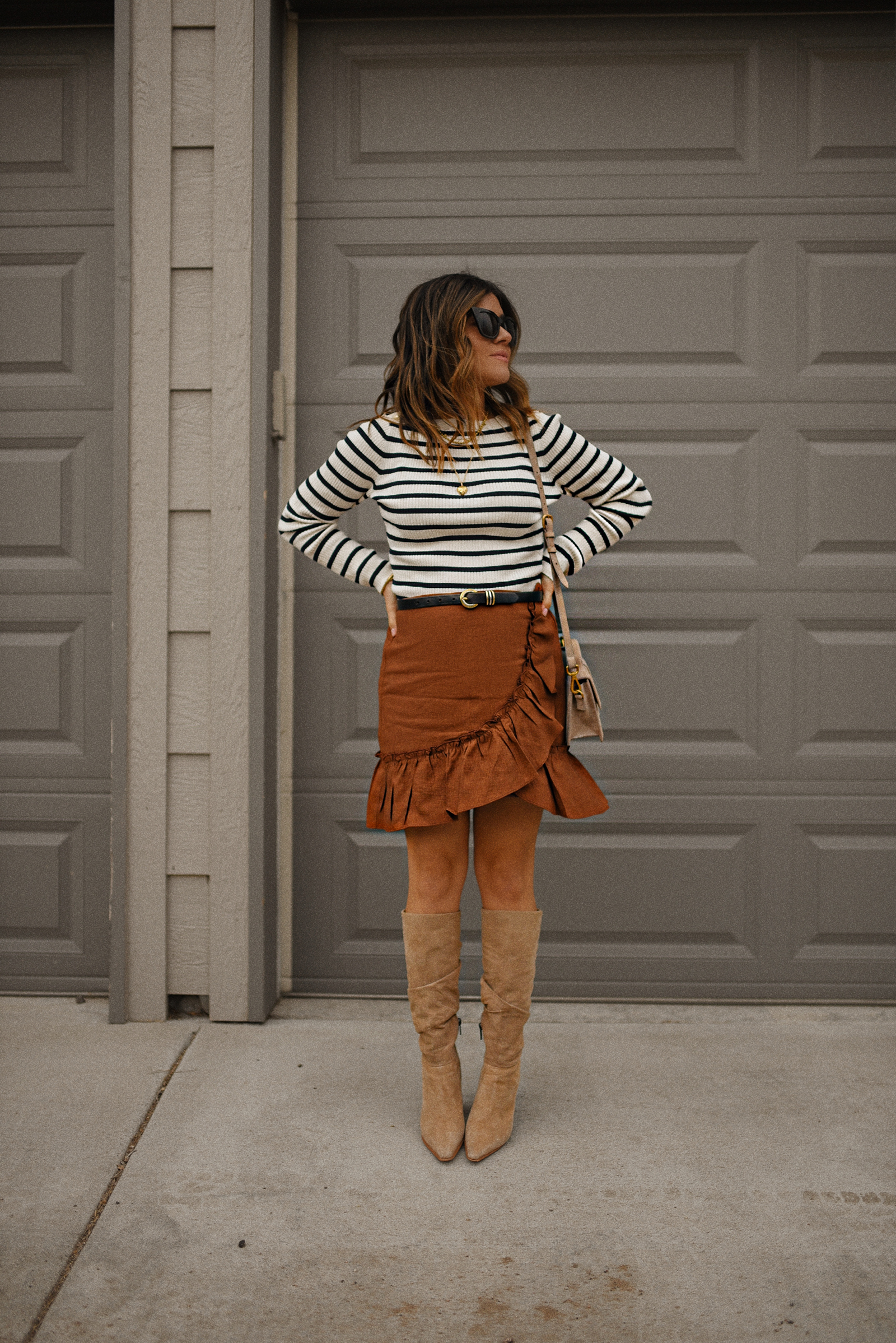 Carolina Hellal of Chic talk wearing an h&m striped nautical sweater, express wrap mini skirt and vince camuto tall suede boots. 