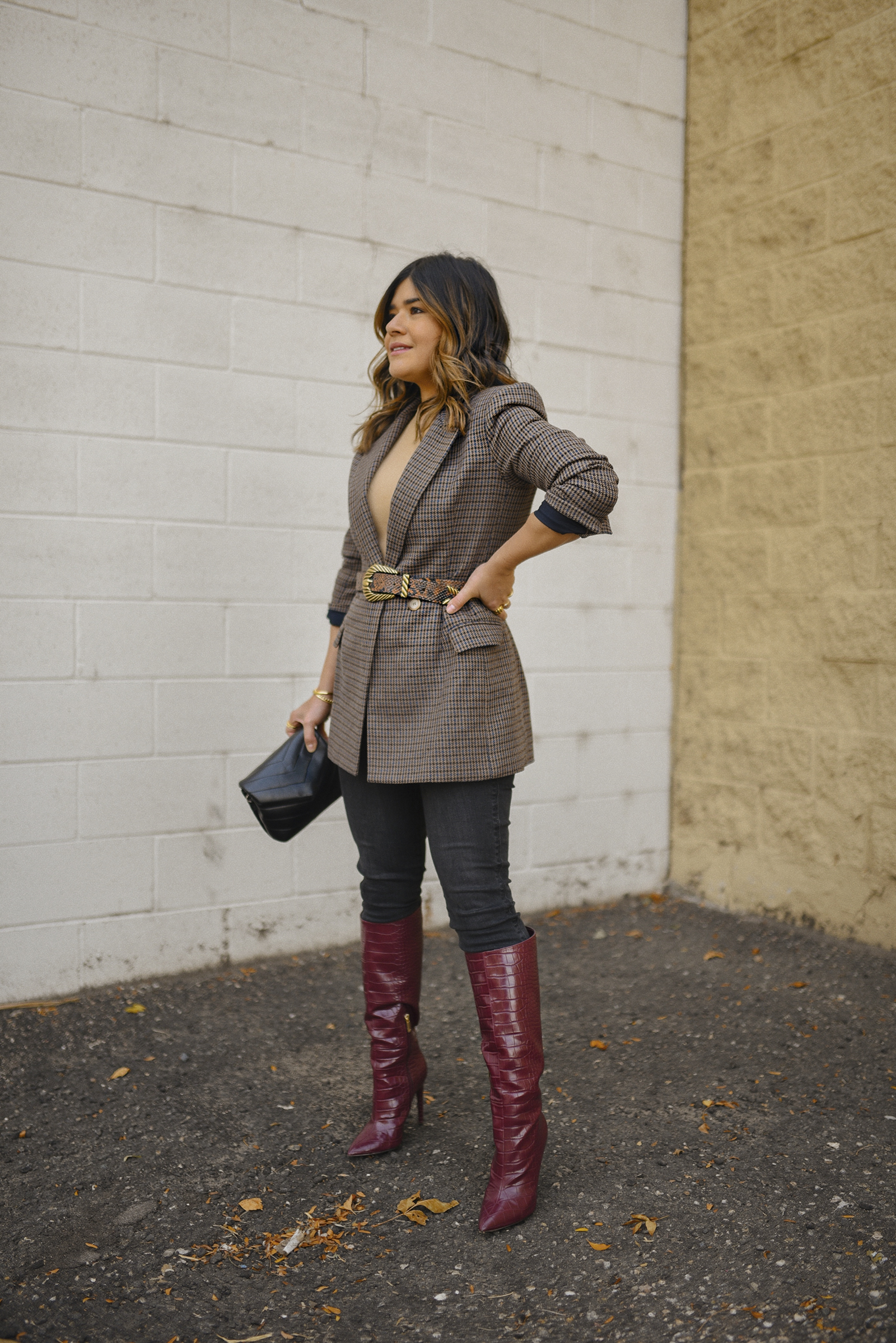 Carolina Hellal of Chic Talk wearing a plaid blazer, JBrand jeans, JLO Jennifer Lopez red wine tall boots and YSL crossbody bag