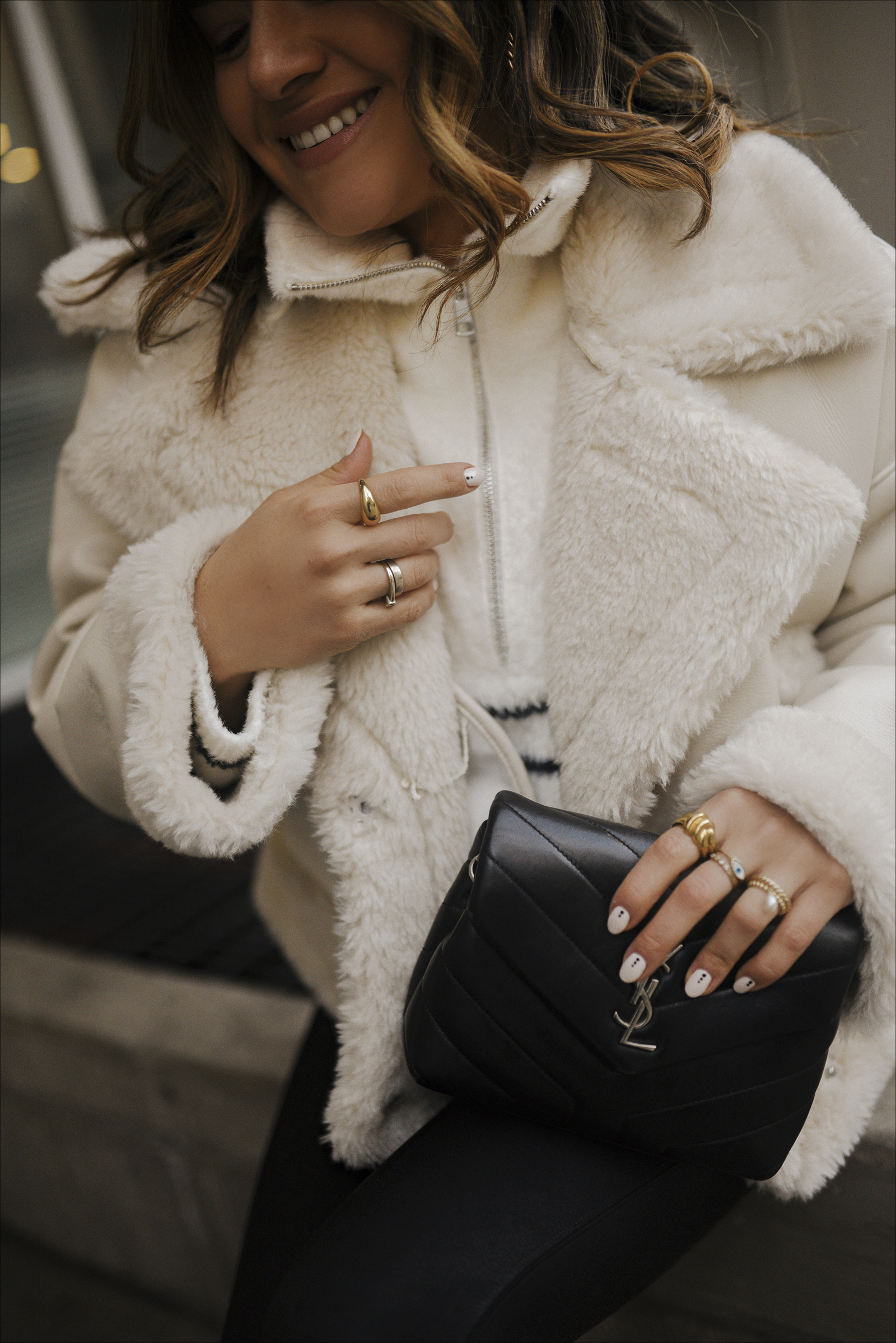Carolina Hellal of Chic Talk wearing an Abercrombie Sherpa Lined Coat, Spanx faux leather leggings, Vince Camuto suede chunky boots and Yves Saint Laurent black crossbody bag