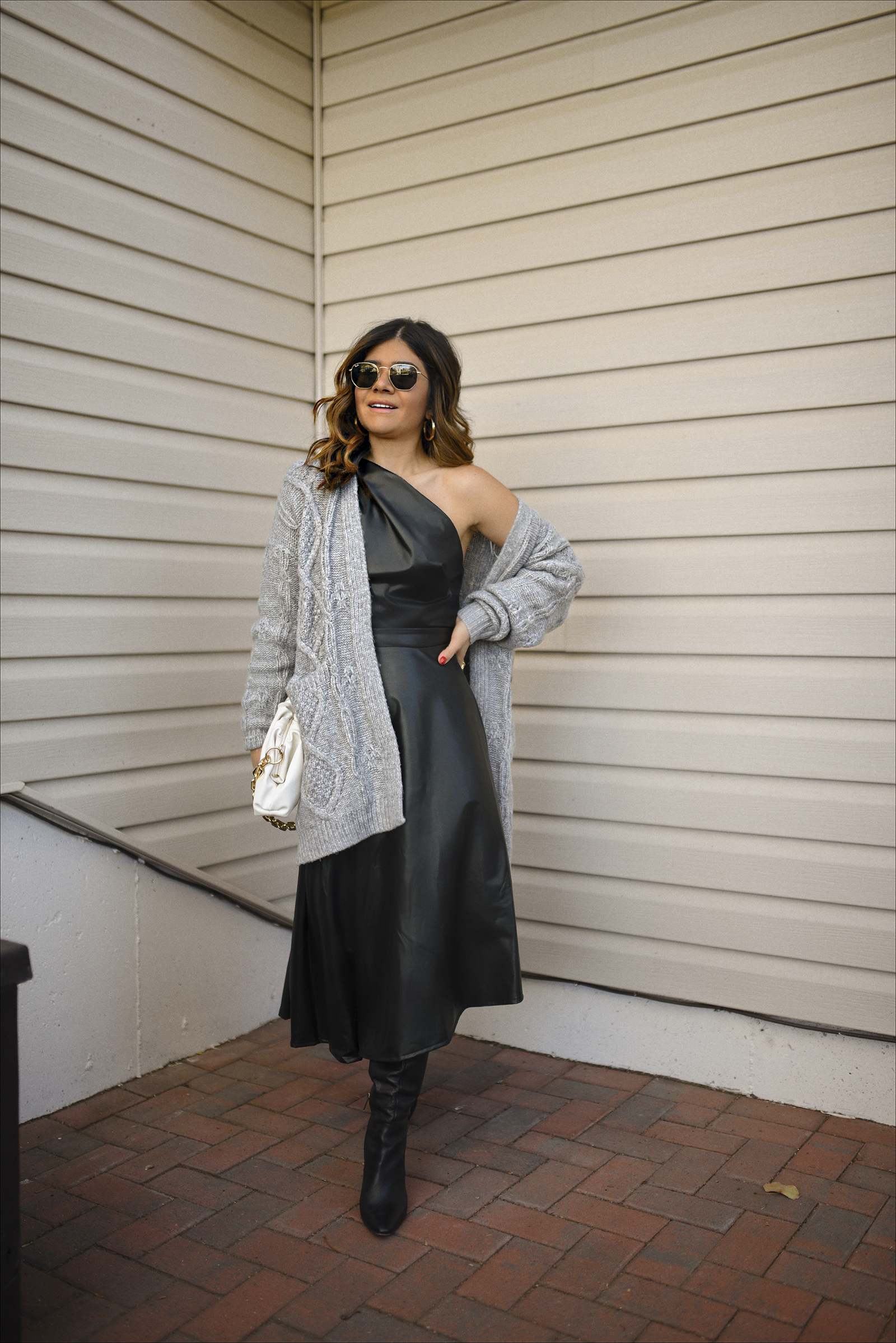 Carolina Hellal of Chic Talk wearing a faux leather dress and knit cardigan via Walmart fashion. 