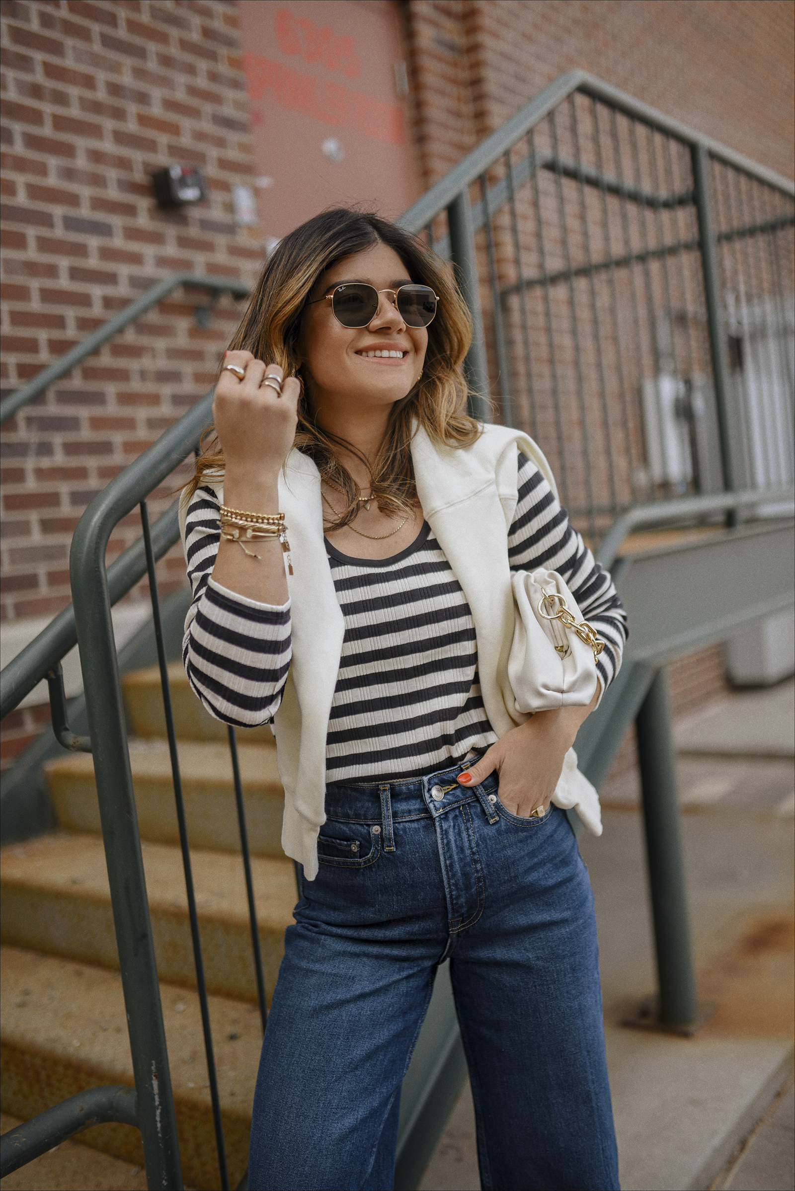 Carolina Hellal of Chic Talk wearing a Free Assembly stripe top, and cropped jeans via Walmart. 