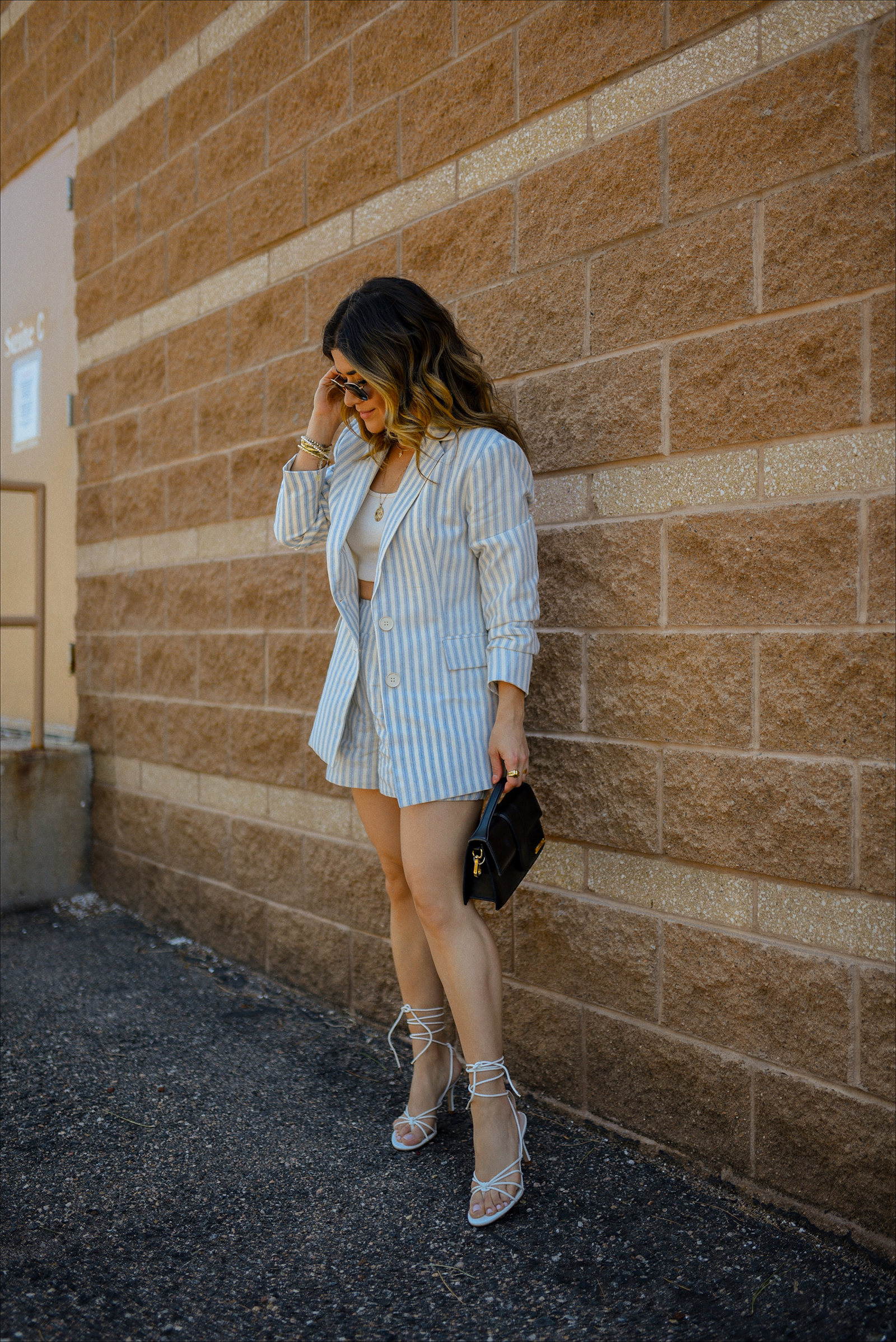 Carolina Hellal of Chic Talk wearing the prettiest blazer and shorts set via Gibsolook, lace-up sandals from Amazon, and a black Jacquemus Le Bambino Bag. 