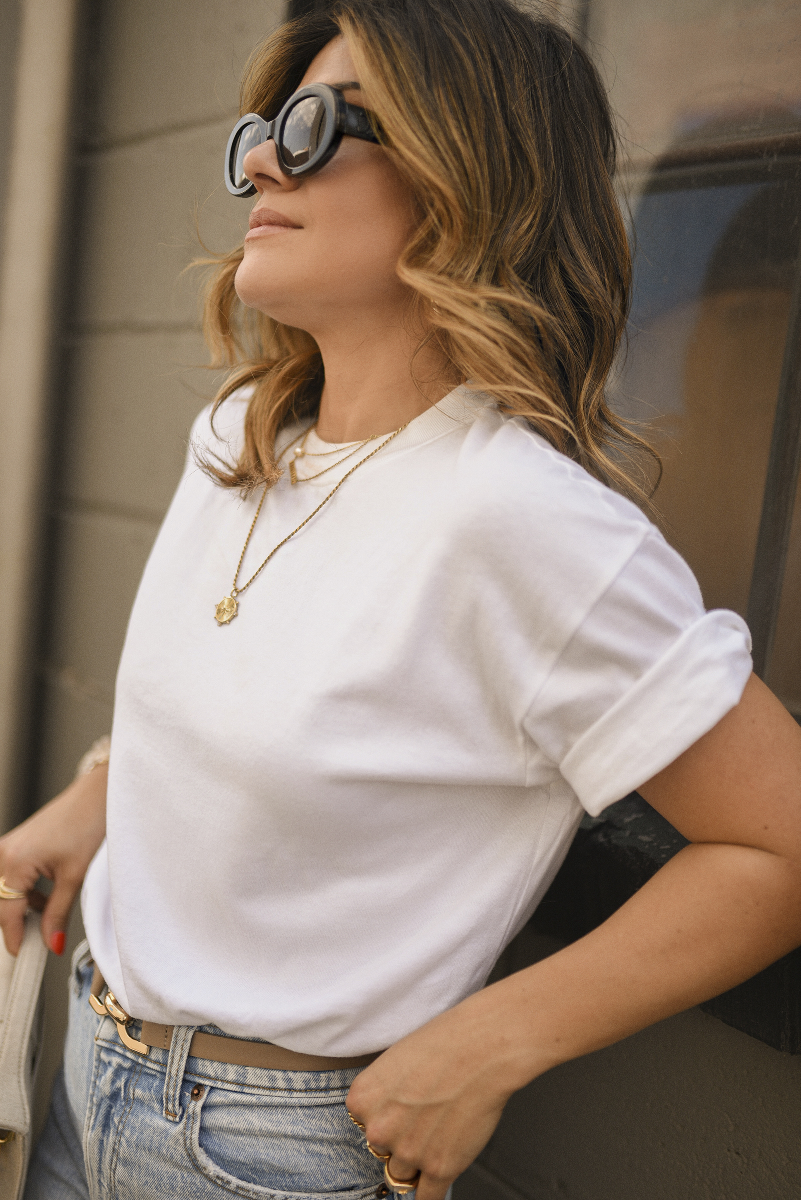 Carolina Hellal of Chic Talk wearing a white tee and straight leg jeans via Abercrombie, Celine sunglasses, Jacquemus , Sam Edelman suede pumps and Miranda Frye gold jewelry. 