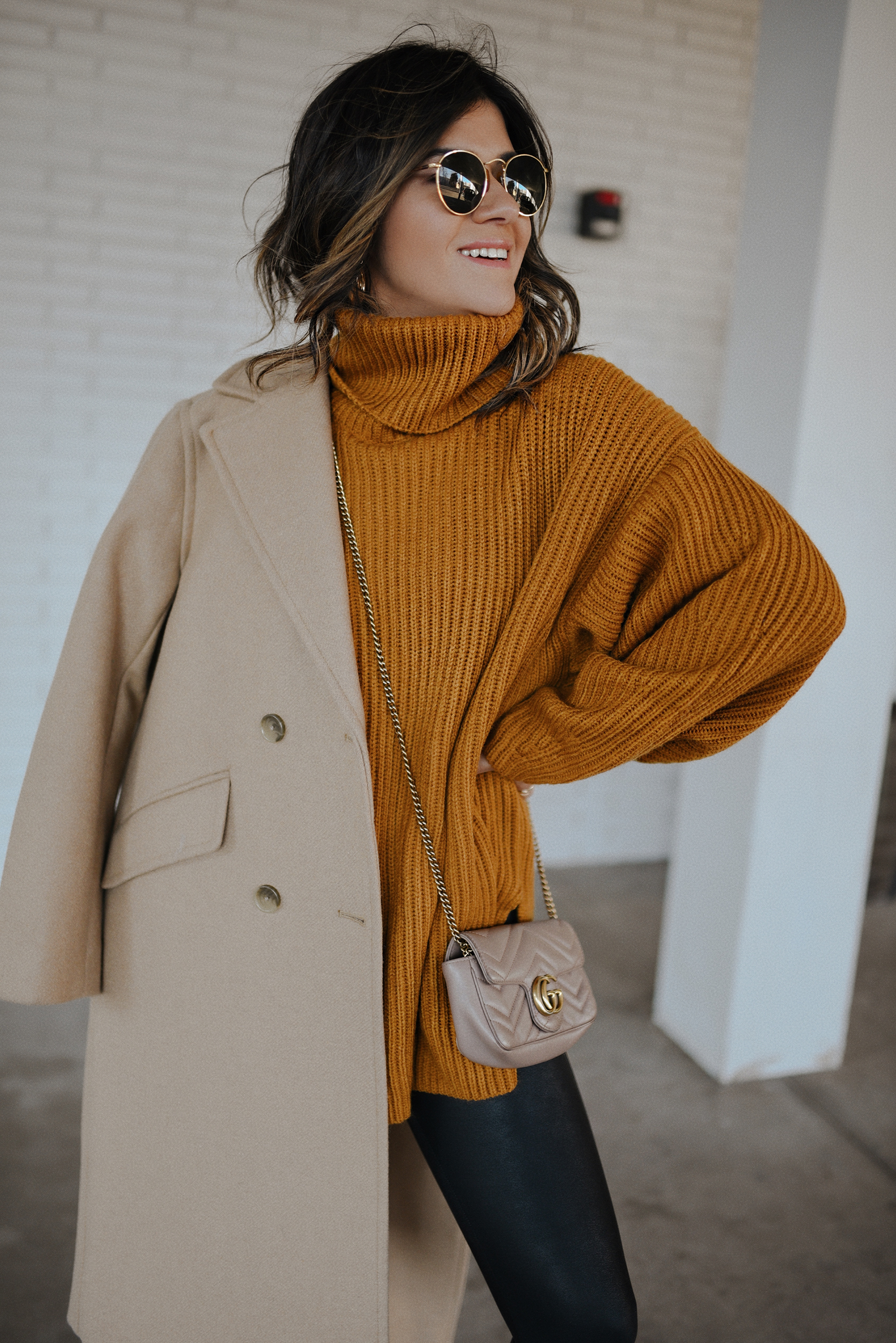 CAROLINA HELLAL FROM CHIC TALK WEARING A COZY MUSTARD SWEATER DRESS, A BEIGE COAT AND A CROSSBODY BAG GUCCI