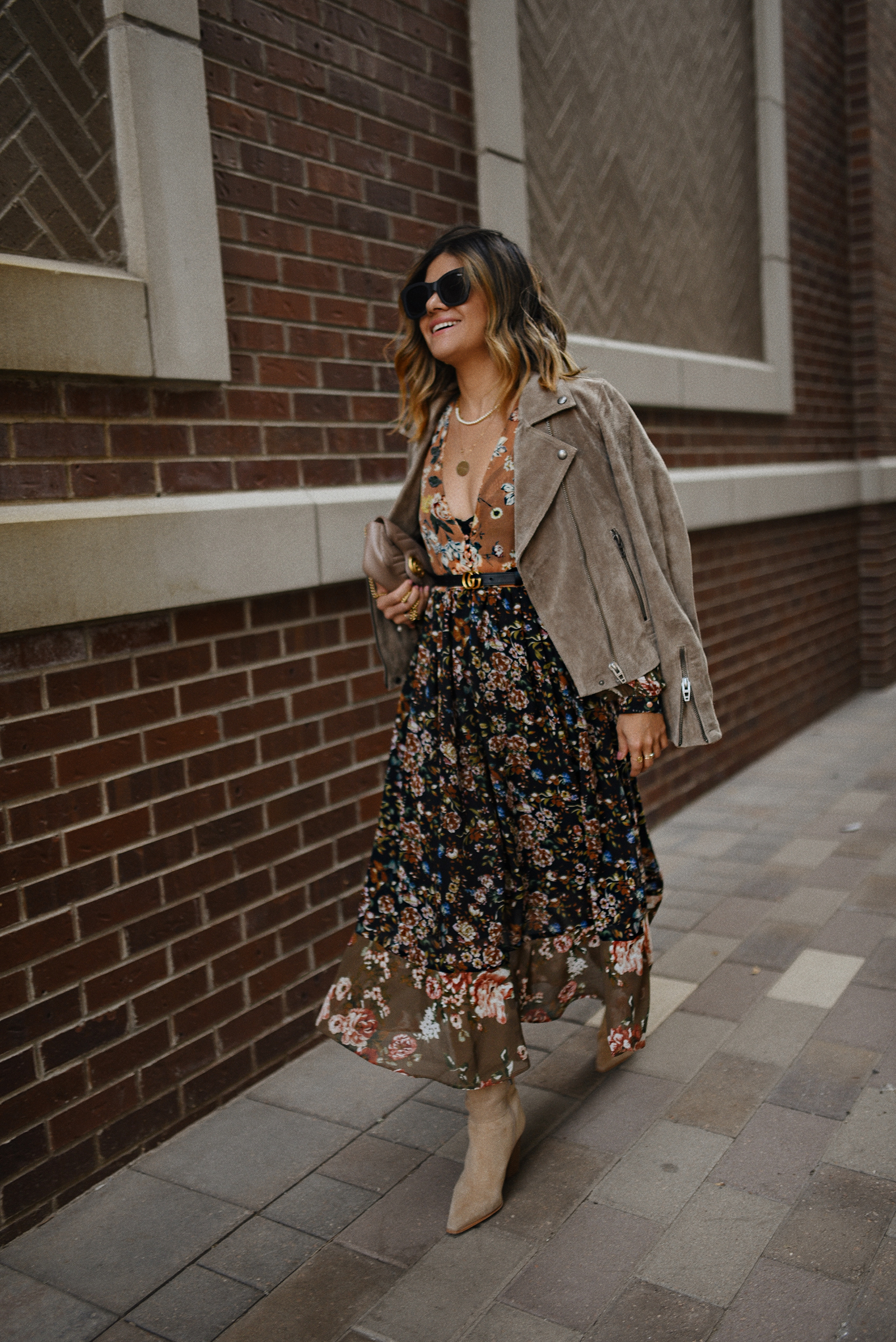 CAROLINA HELLAL FROM CHIC TALK WEARING A FALL FLORAL DRESS AND SUEDE JACKET AND BOOTS