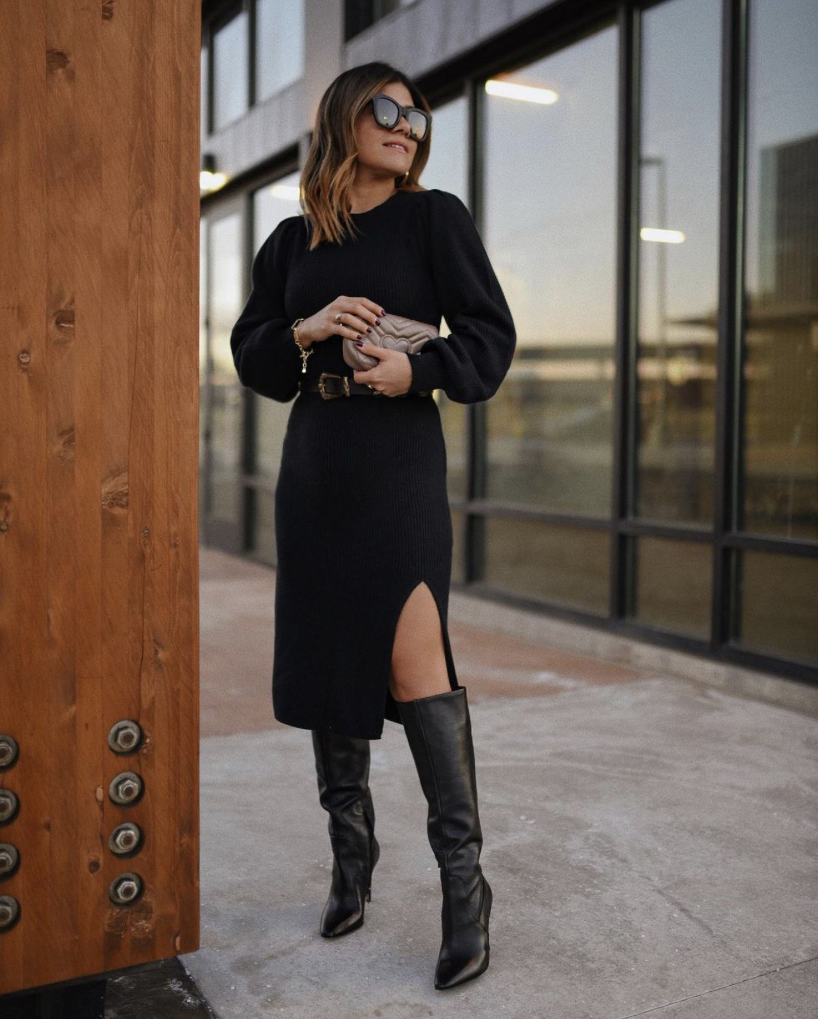 CAROLINA HELLAL FROM CHIC TALK WEARING A KNITTED BLACK DRESS WITH SLOUCHY BOOTS