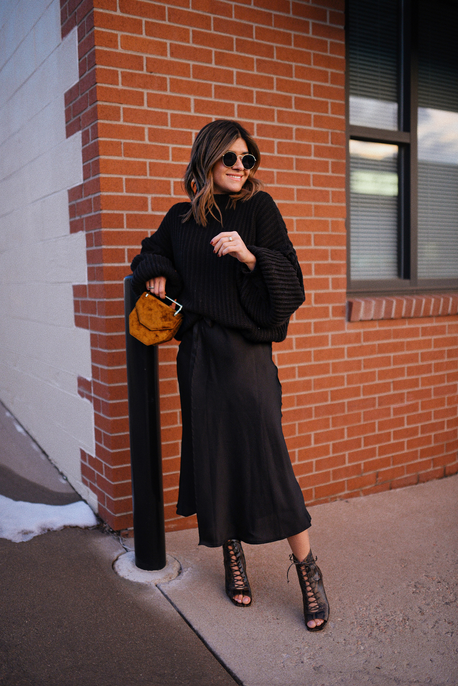 CAROLINA HELLAL FROM CHIC TALK WEARING A TOTAL BLACK LOOK WITH SILK MIDI SKIRT AND KNITTED SWEATER