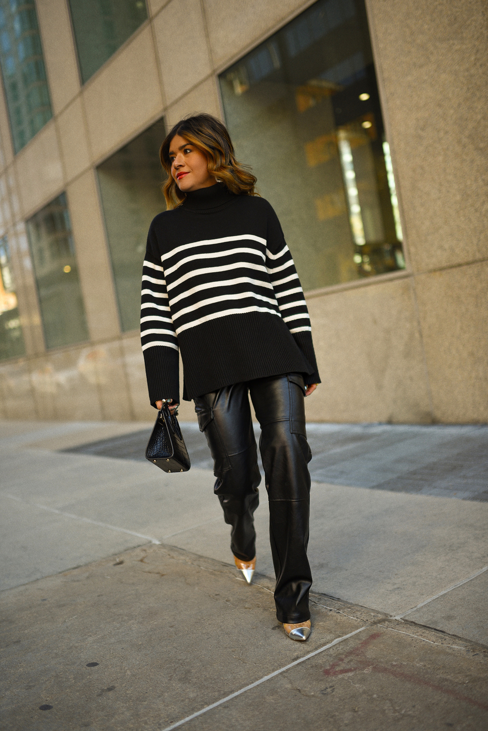 CAROLINA HELLAL OF CHIC TALK WEARING GAP VEGAN LEATHER CARGO PANTS, STRIPPED SWEATER, AVIATOR JACKET, SILVER PUMPS AND STRATHBERRY LEATHER HANDBAG