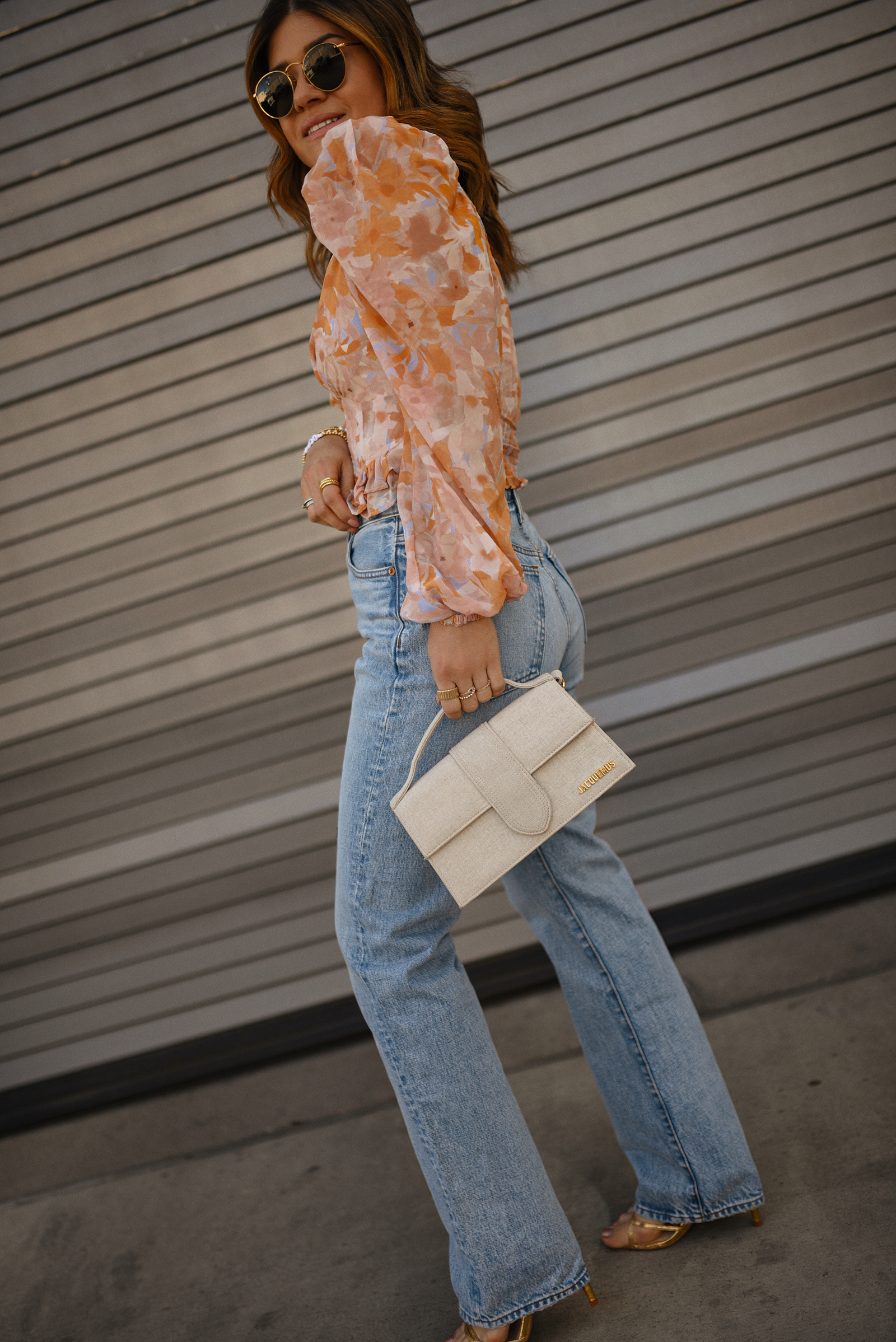 Carolina Hellal of Chic Talk wearing a ASTR The Label top, a Madewell straight jean, a Steve Madden heels sandals and Le bambino bag via Jacquemus