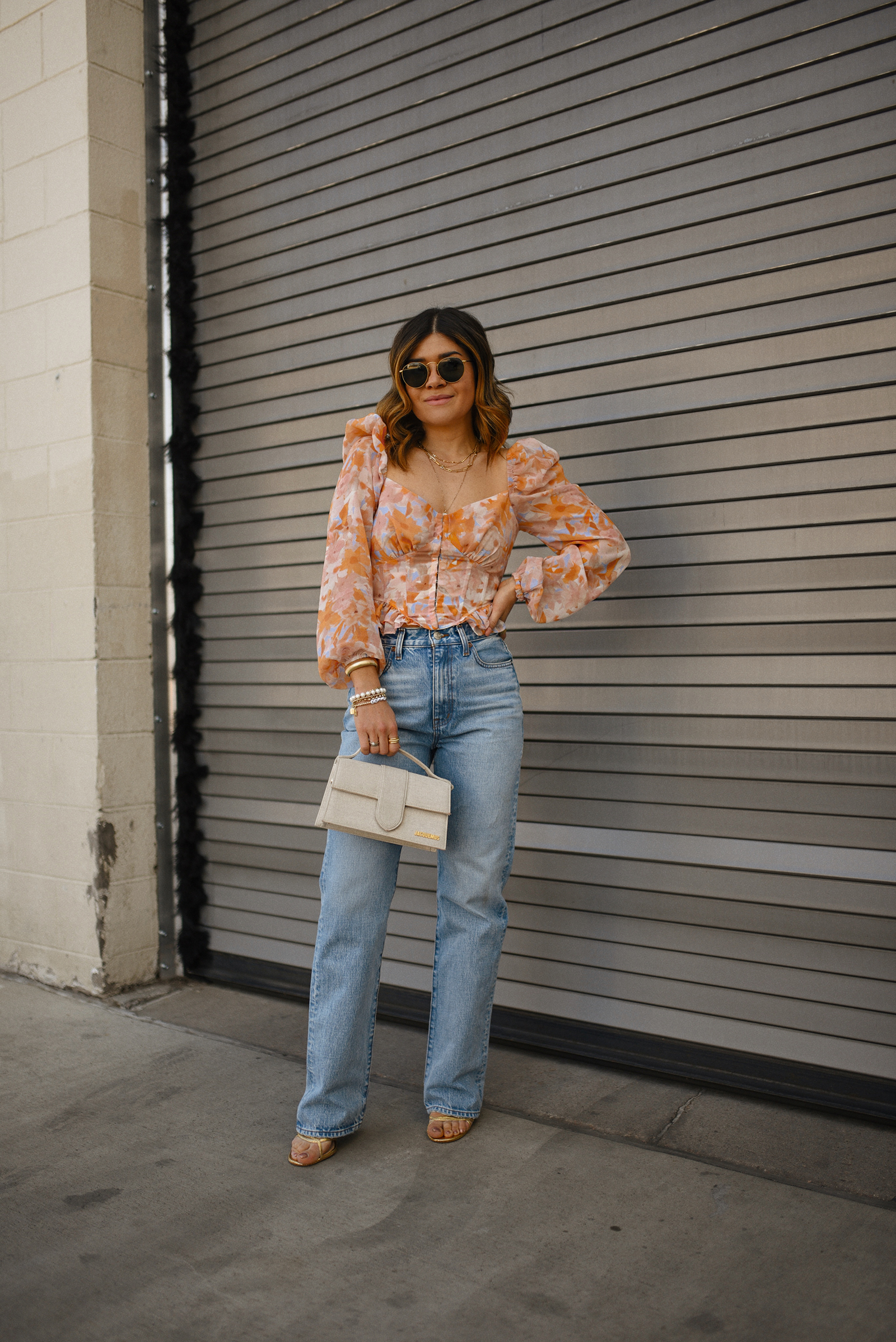 Carolina Hellal of Chic Talk wearing a ASTR The Label top, a Madewell straight jean, a Steve Madden heels sandals and Le bambino bag via Jacquemus