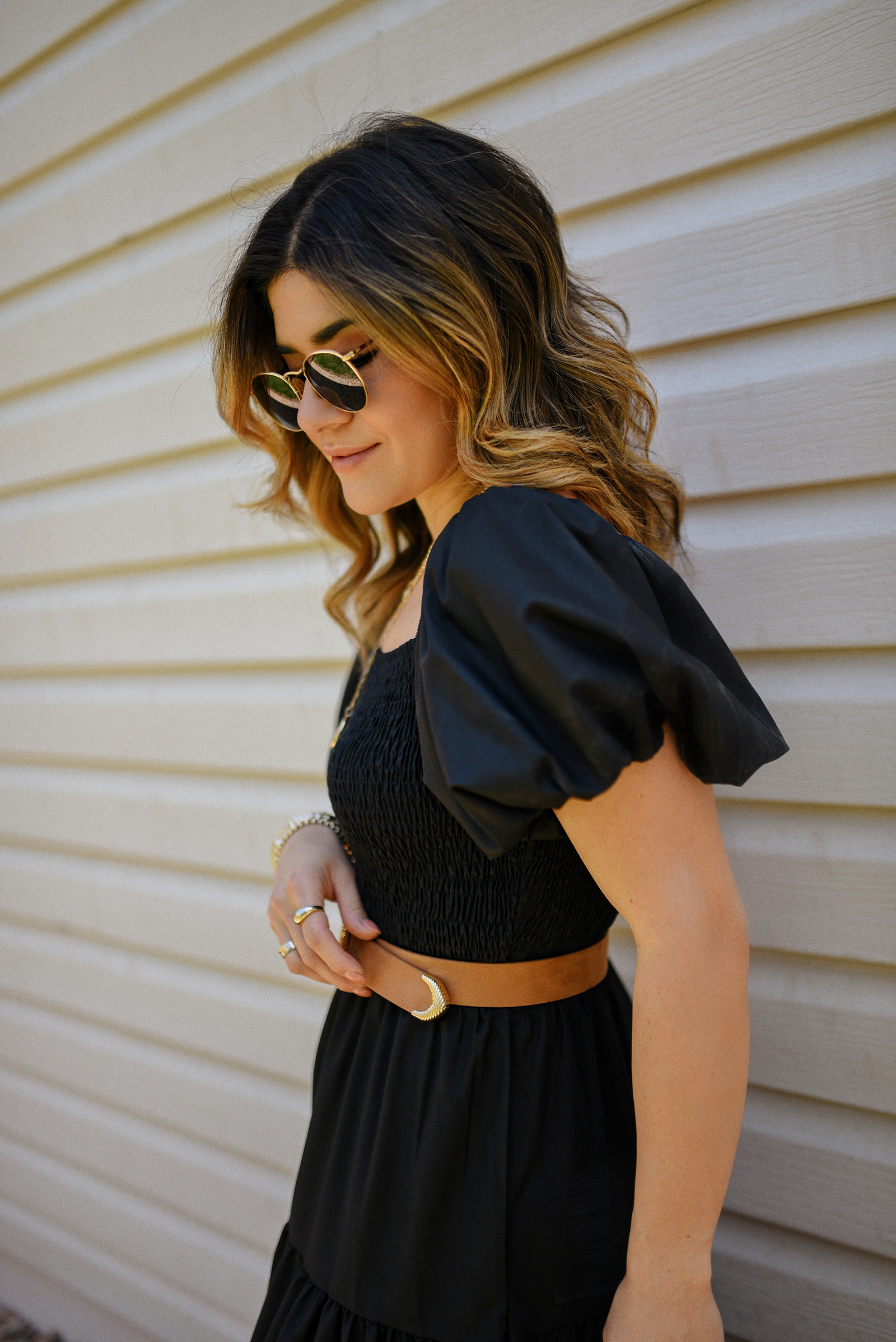 Carolina Hellal of Chic Talk wearing a blak maxi dress via Amazon, braided brown sandals, box hand bag and Ray-Ban sunglasses