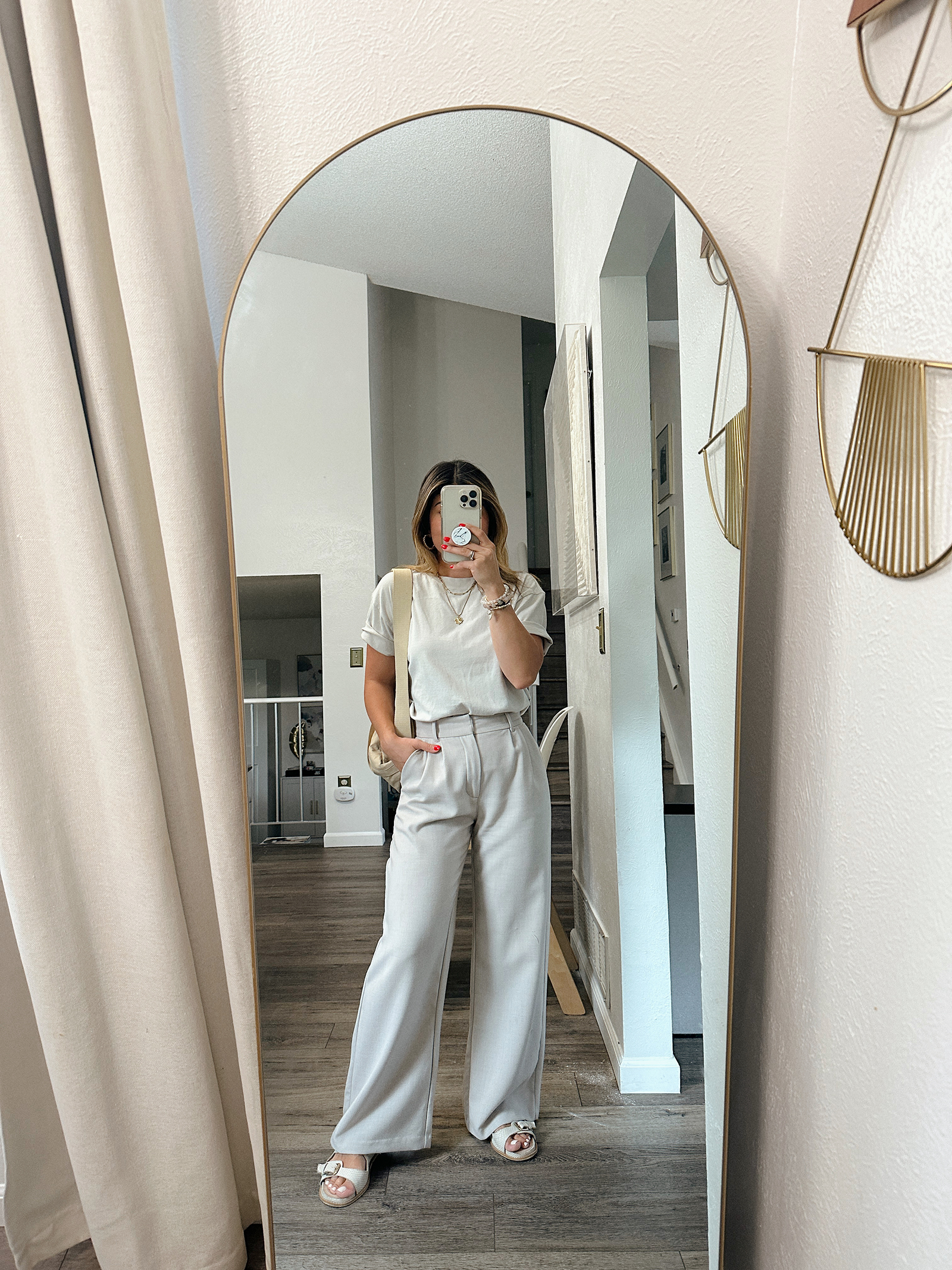 Carolina Hellal of Chic Talk wearing a tailored pants and t-shirt via Abercrombie, Canvelle Fanny pack and Steve Madden sandals