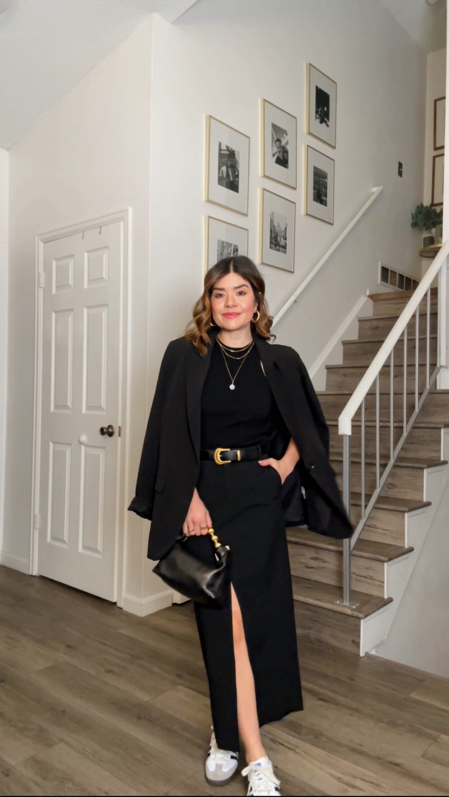 Carolina Hellal of Chic Talk wearing a Nordstroms black midi skirt, black top and black blazer and a Samba OG via Adidas