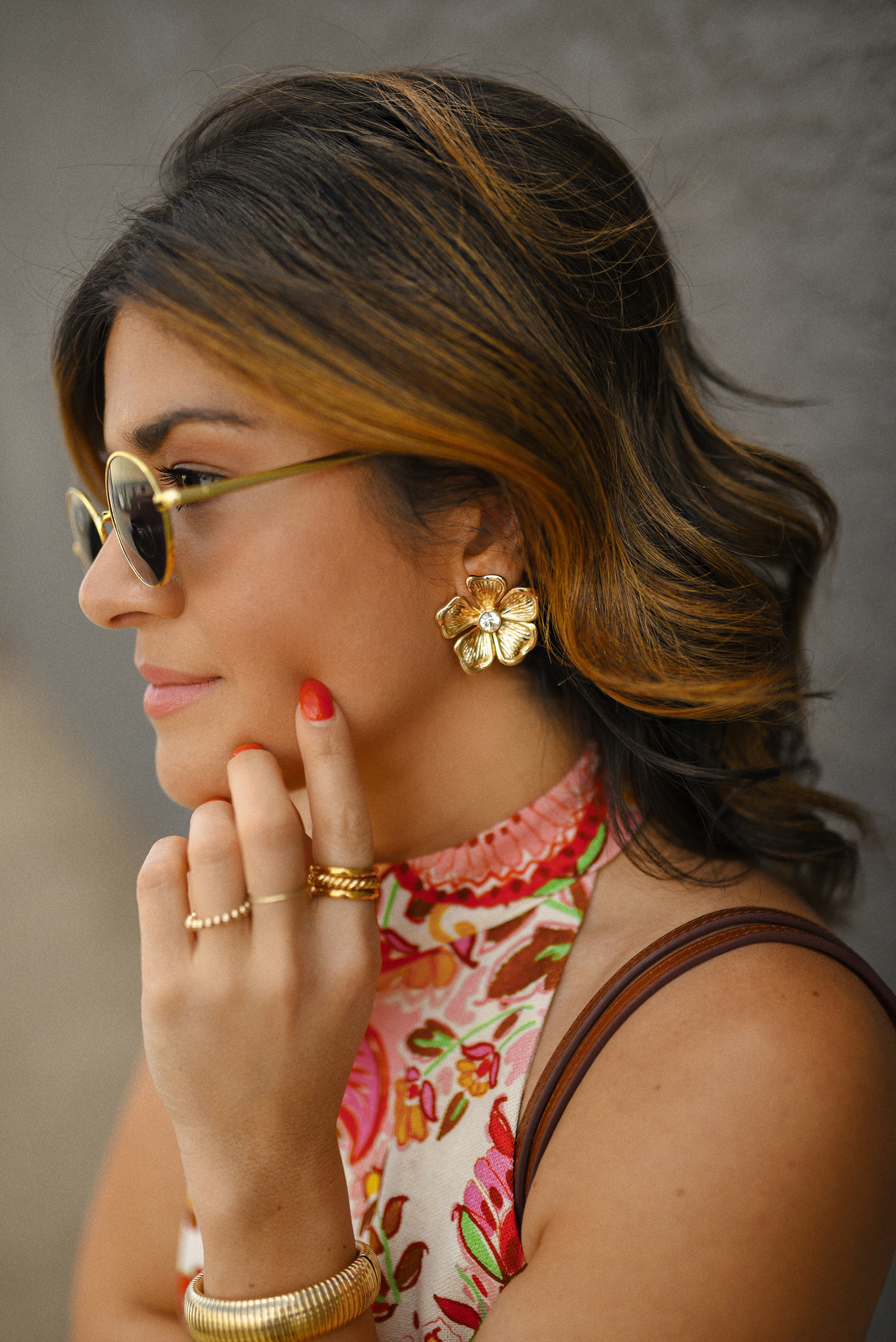 Carolina Hellal of Chic Talk wearing a Sezane floral set of top and midi skirt, a rafia bag, a Target sandals and Amazon sunglasses