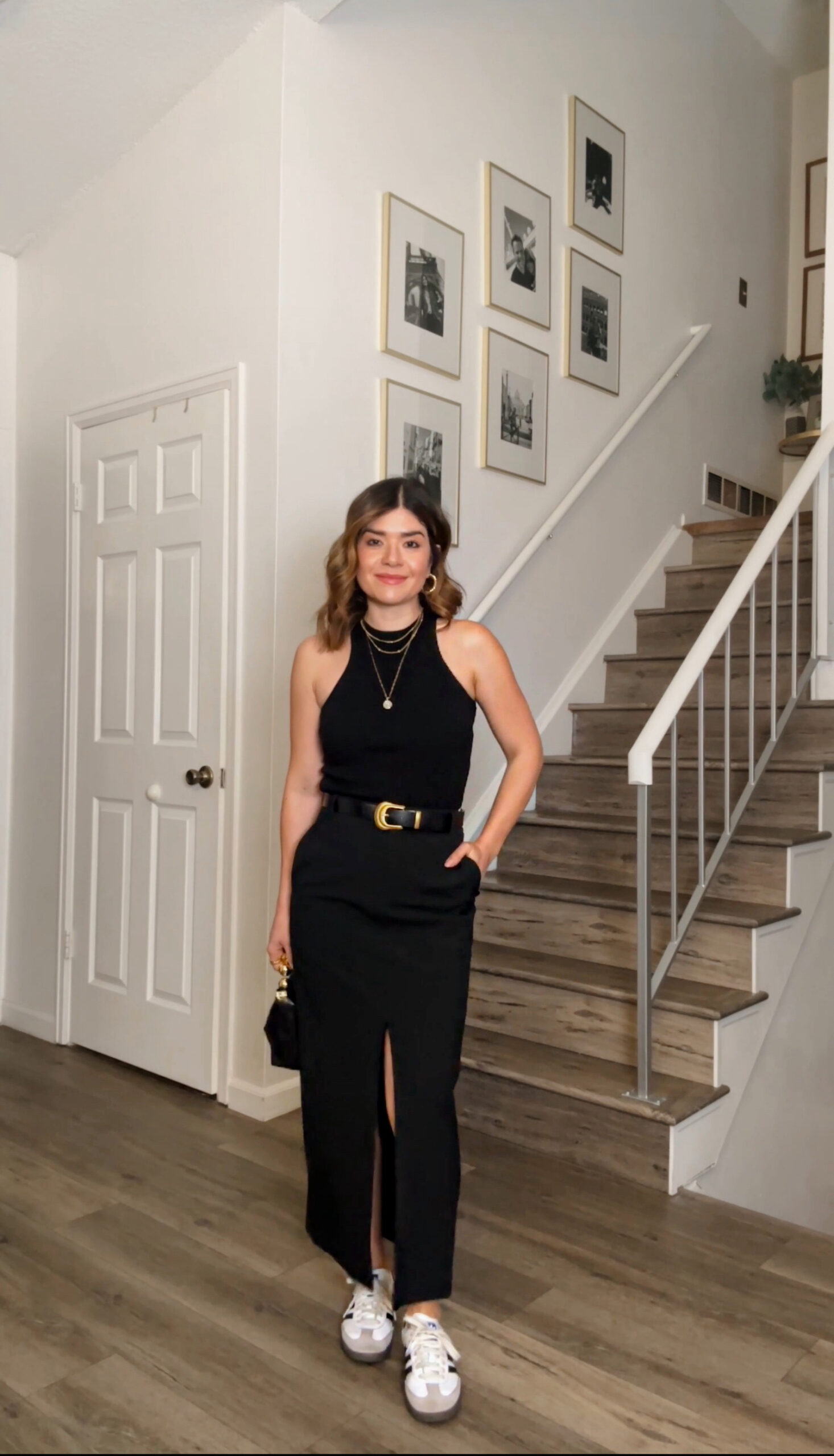 Carolina Hellal of Chic Talk wearing a black midi skirt from Nordstrom, tank top via target, Adidas Samba OG shoes and a handbag and belt from Amazon