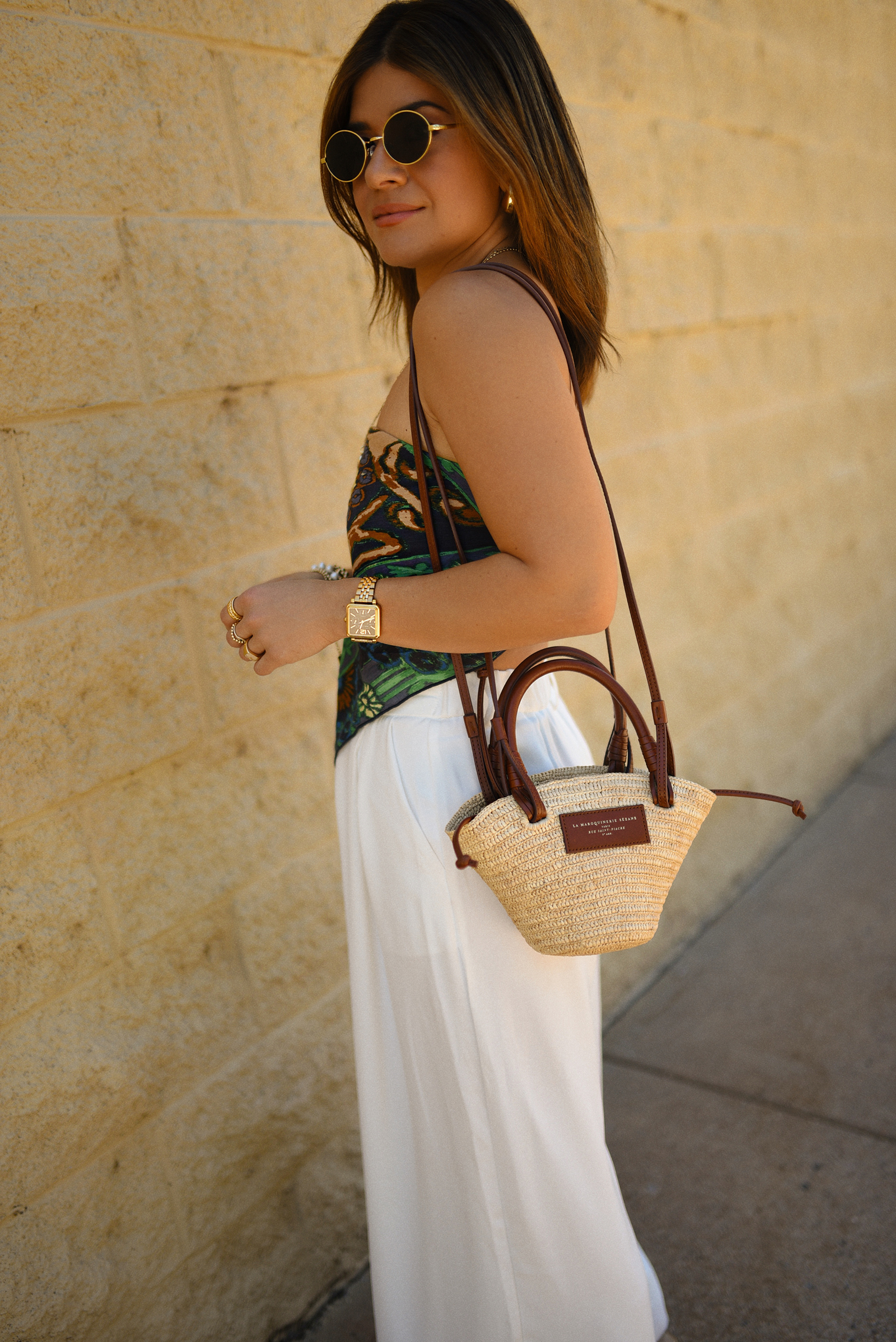 Carolina Hellal of Chic Talk wearing a Bandana top via Free people, trousers pants, Sezane rafia bag and Boden Sandals