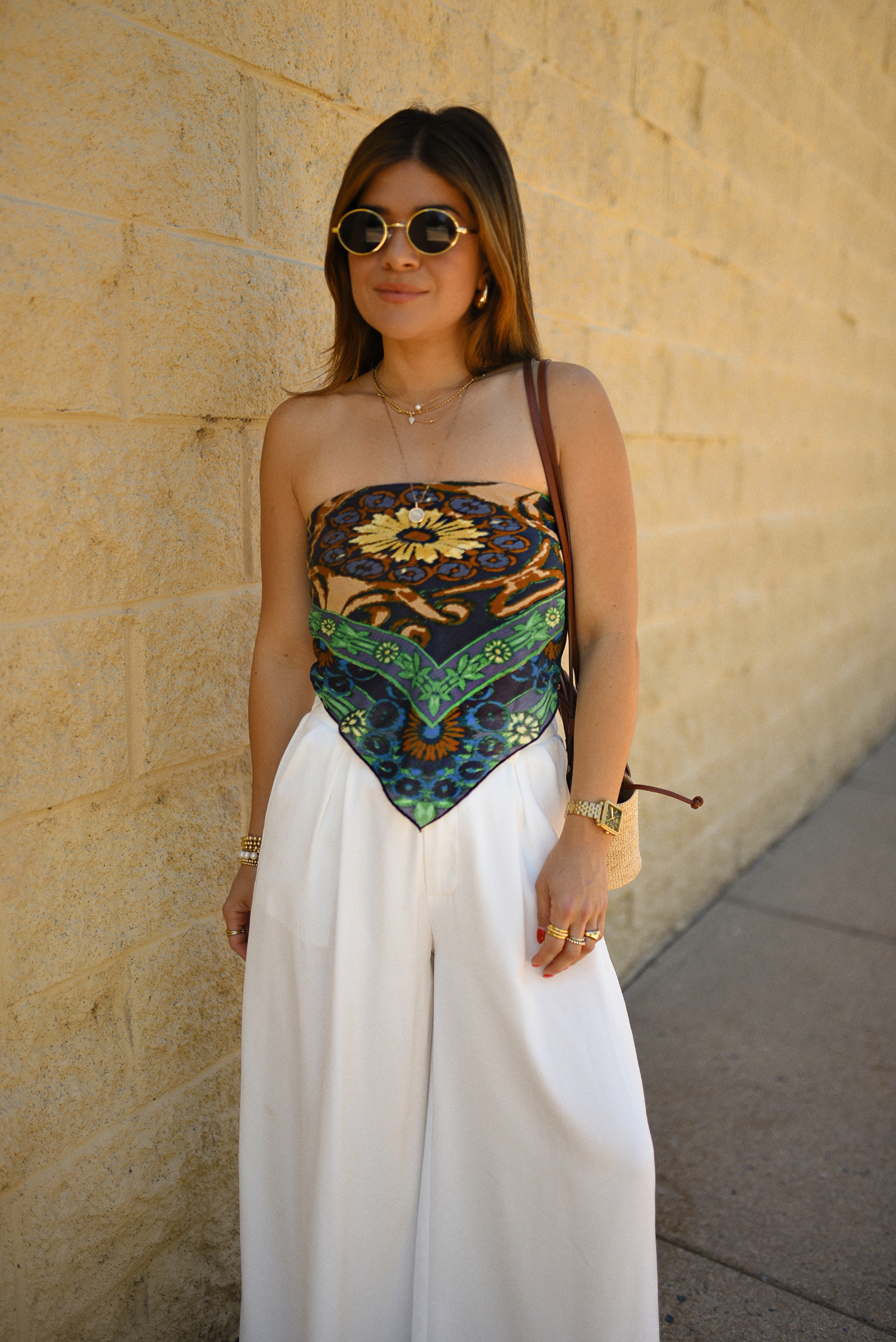 Carolina Hellal of Chic Talk wearing a Bandana top via Free people, trousers pants, Sezane rafia bag and Boden Sandals