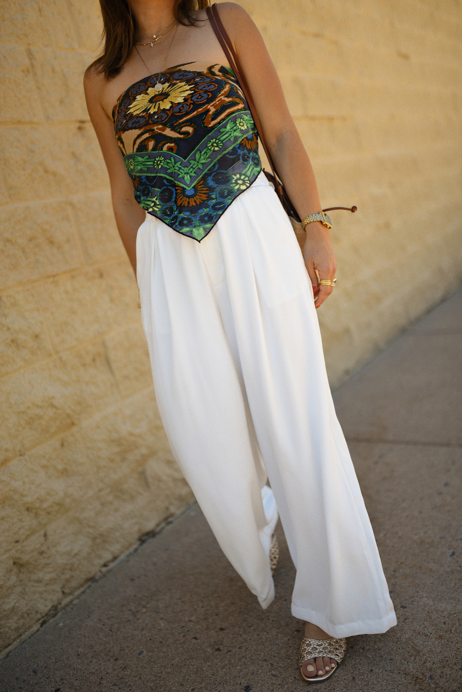 Carolina Hellal of Chic Talk wearing a Bandana top via Free people, trousers pants, Sezane rafia bag and Boden Sandals