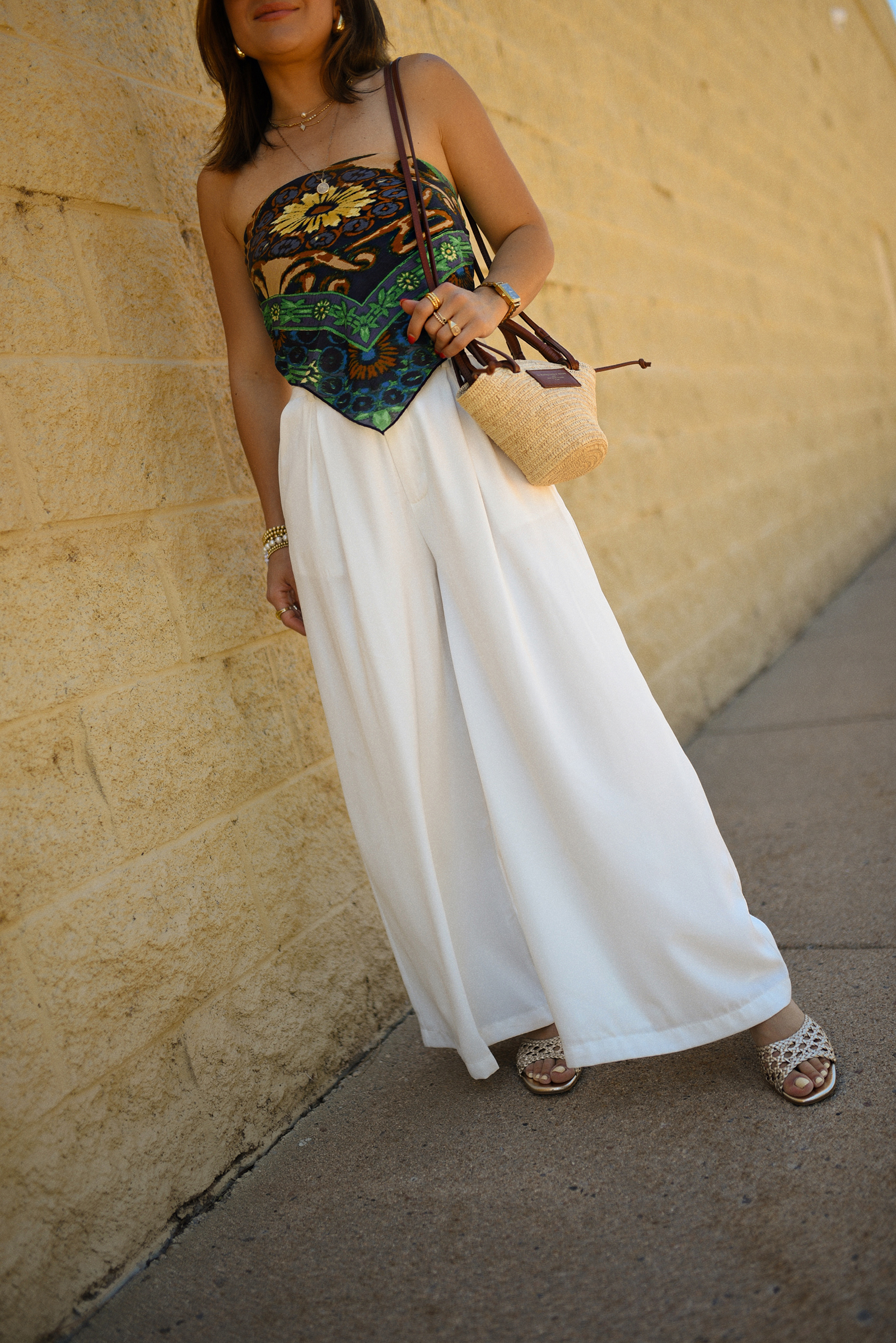 Carolina Hellal of Chic Talk wearing a Bandana top via Free people, trousers pants, Sezane rafia bag and Boden Sandals