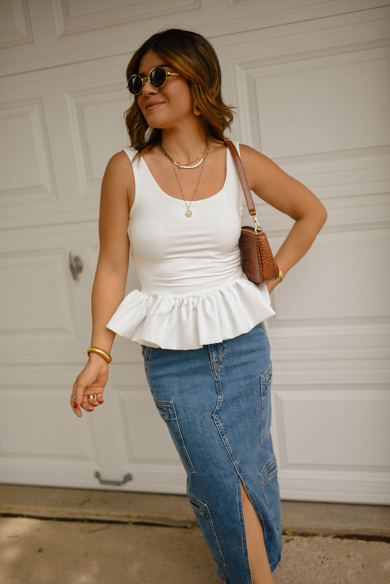 Carolina Hellal of Chic Talk wearing a perfect peplum top via Amazon, Hudson jeans midi cargo skirt, Sam Edelman Mary Jane shoes and Amazon brown shoulder bag