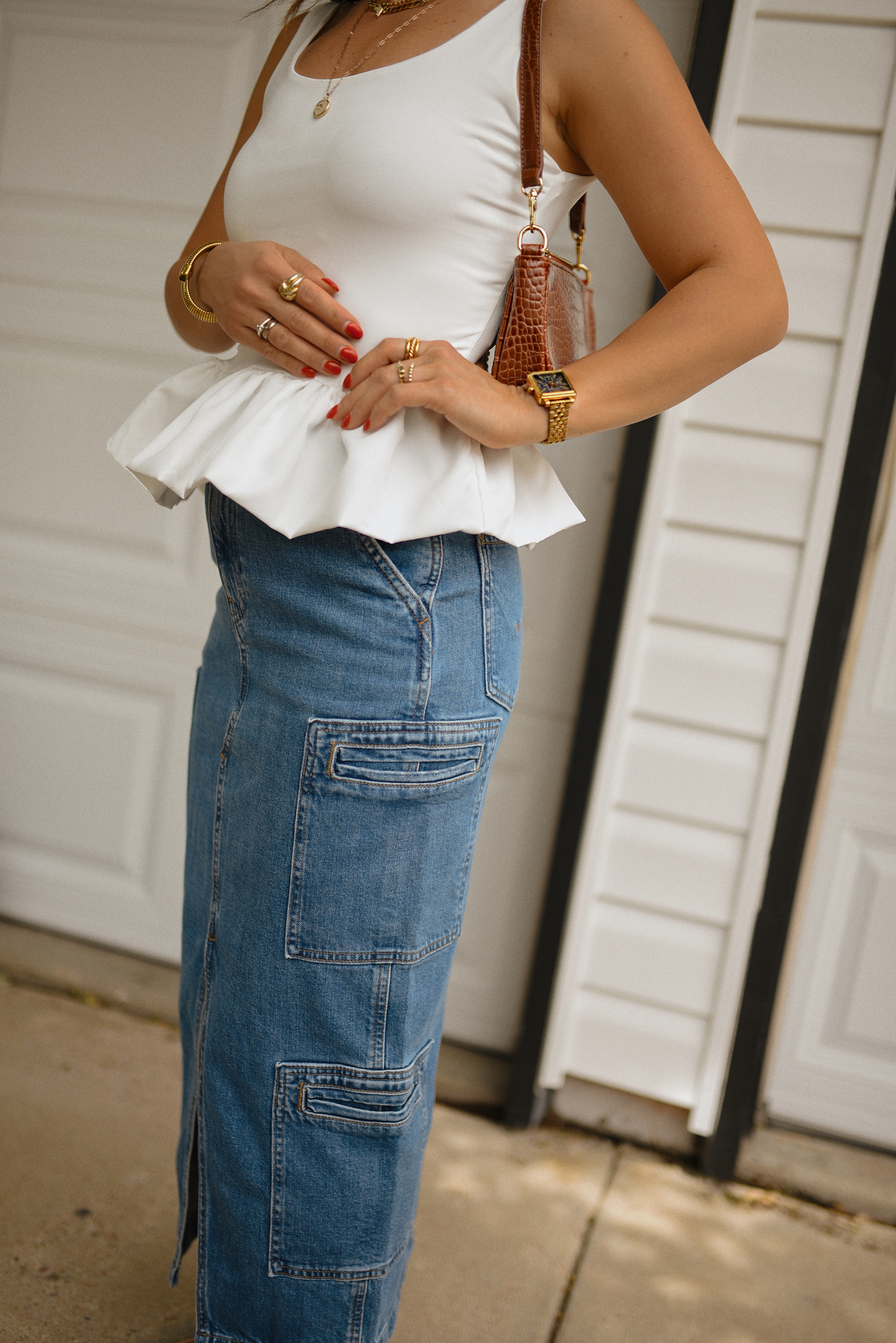 Carolina Hellal of Chic Talk wearing a perfect peplum top via Amazon, Hudson jeans midi cargo skirt, Sam Edelman Mary Jane shoes and Amazon brown shoulder bag