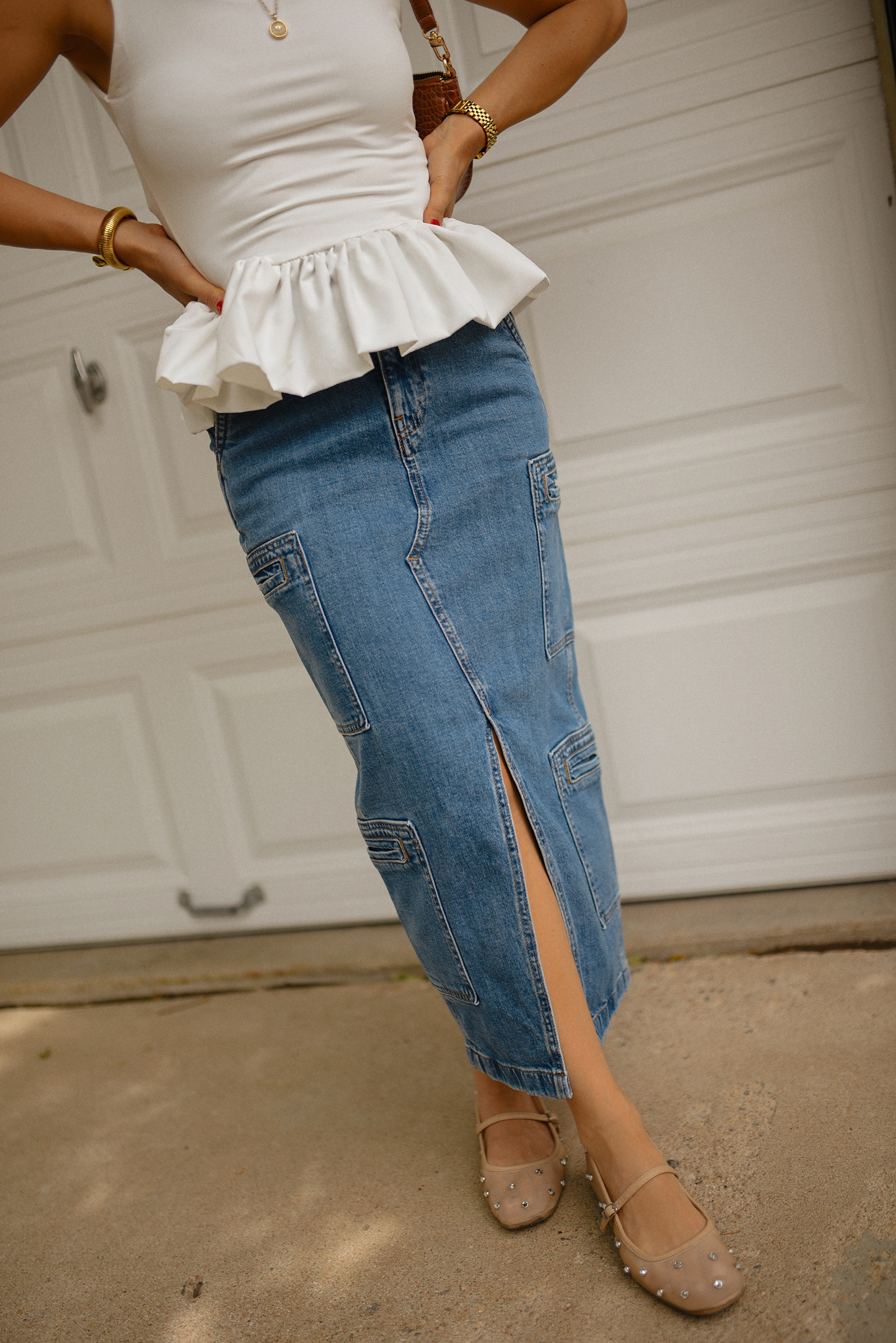 Carolina Hellal of Chic Talk wearing a perfect peplum top via Amazon, Hudson jeans midi cargo skirt, Sam Edelman Mary Jane shoes and Amazon brown shoulder bag