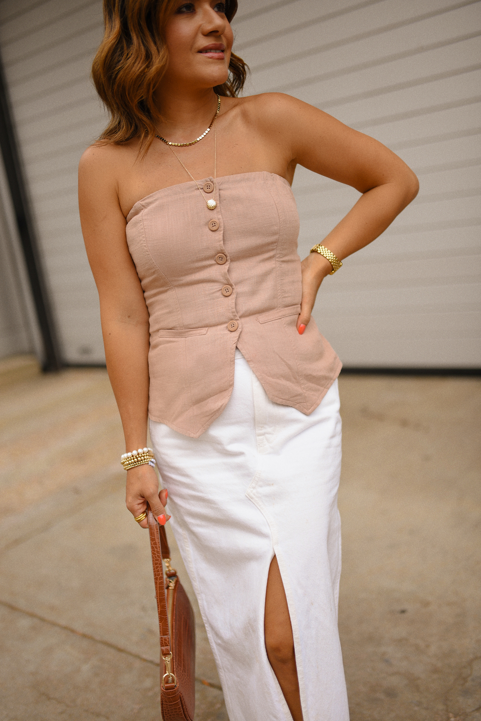 Carolina Hellal of Chic Talk wearing a Madewell white midi skirt, Target suiting tube top, Amazon handbag, and Sam Edelman Mary Jane shoes