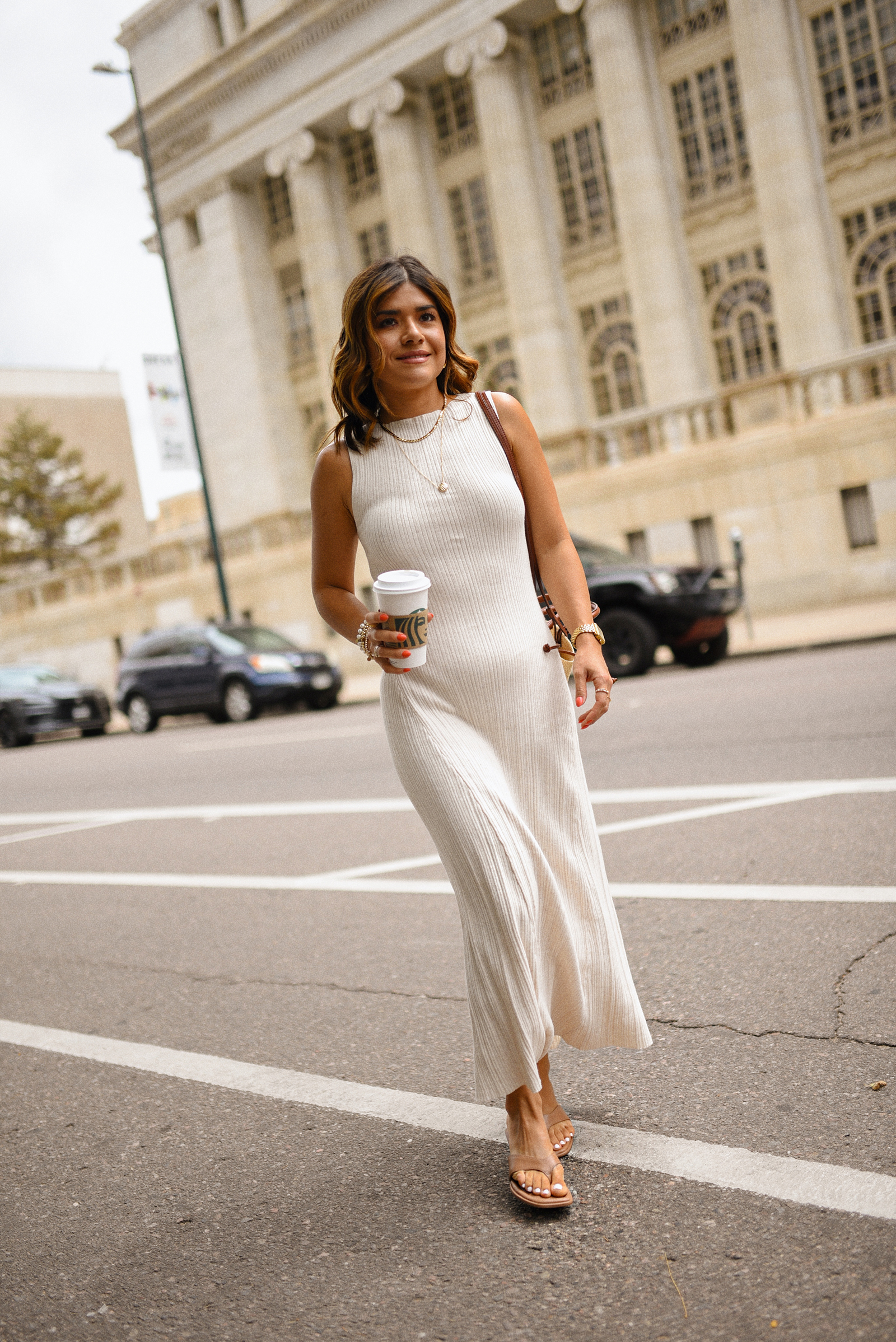 Carolina Hellal of Chic Talk wearing a Target dress and sandals and Sezane handbag