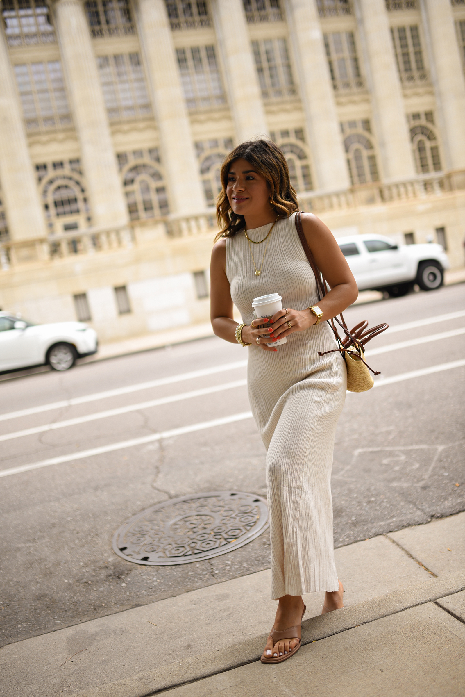 Carolina Hellal of Chic Talk wearing a Target dress and sandals and Sezane handbag