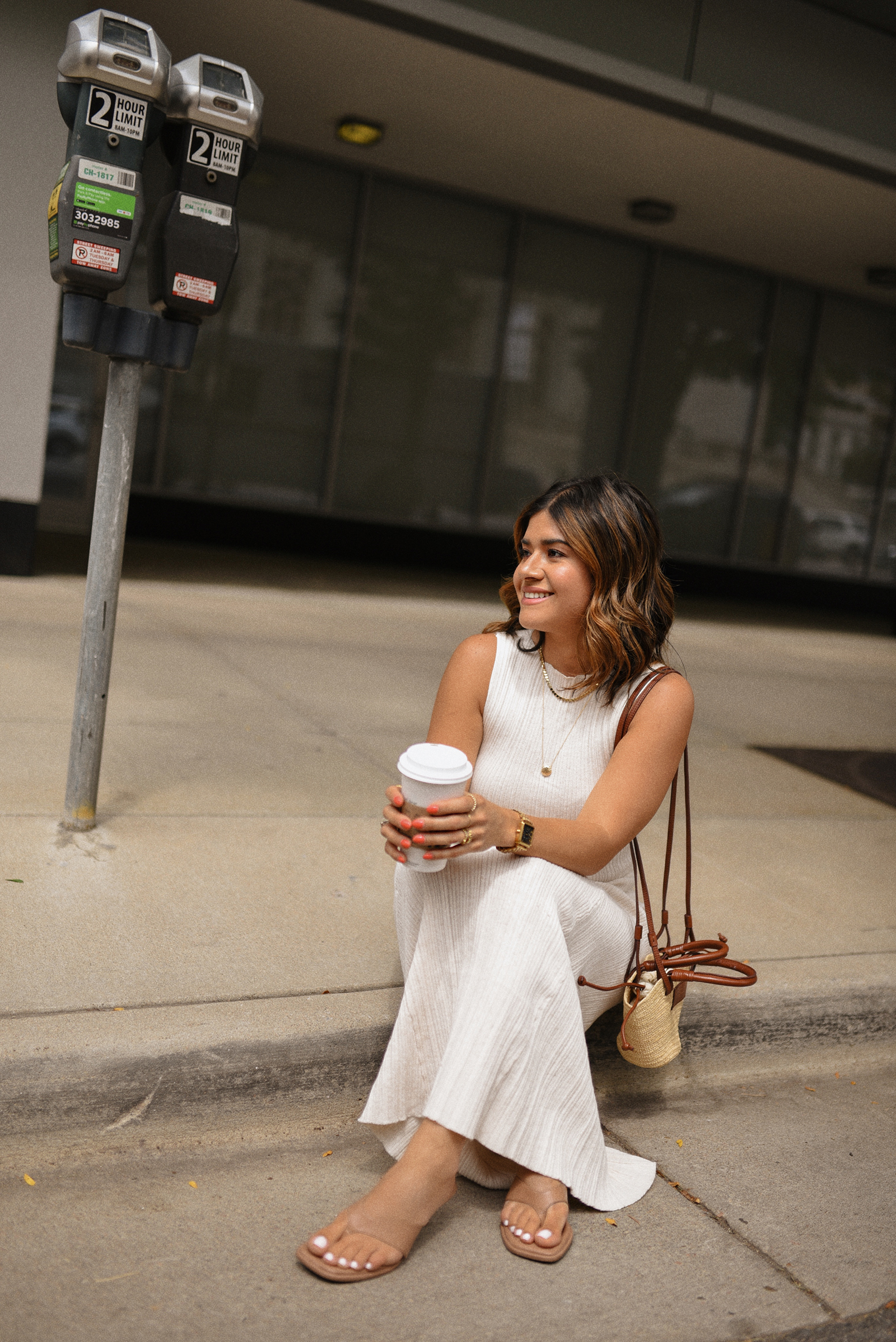 Carolina Hellal of Chic Talk wearing a Target dress and sandals and Sezane handbag