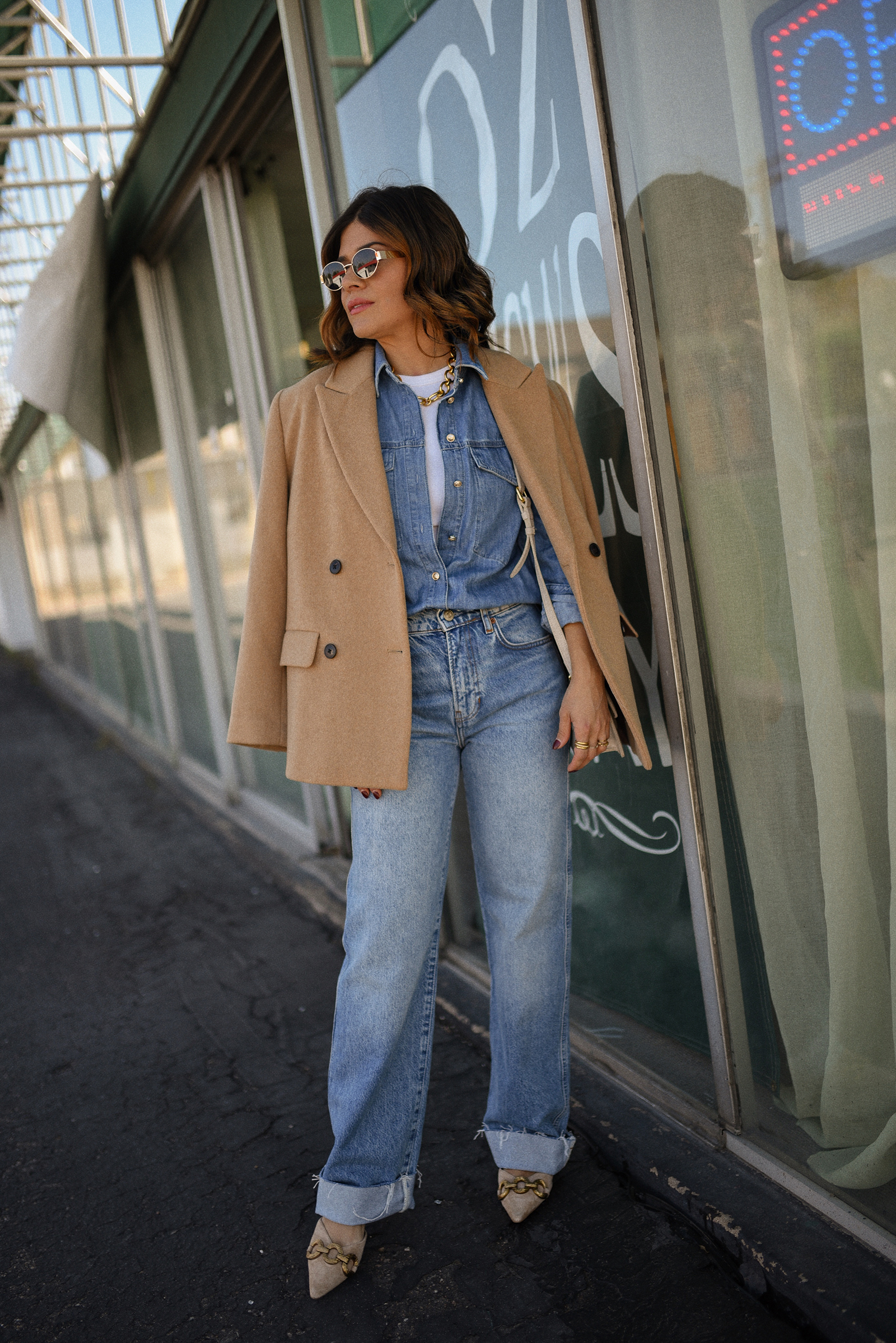 Carolina Hellal of Chic Talk wearing a denim on denim look, shirt via Sezane, wide leg jean from Nordstrom, tank top via Target, Dolce Vita pumps and Jacquemus bag