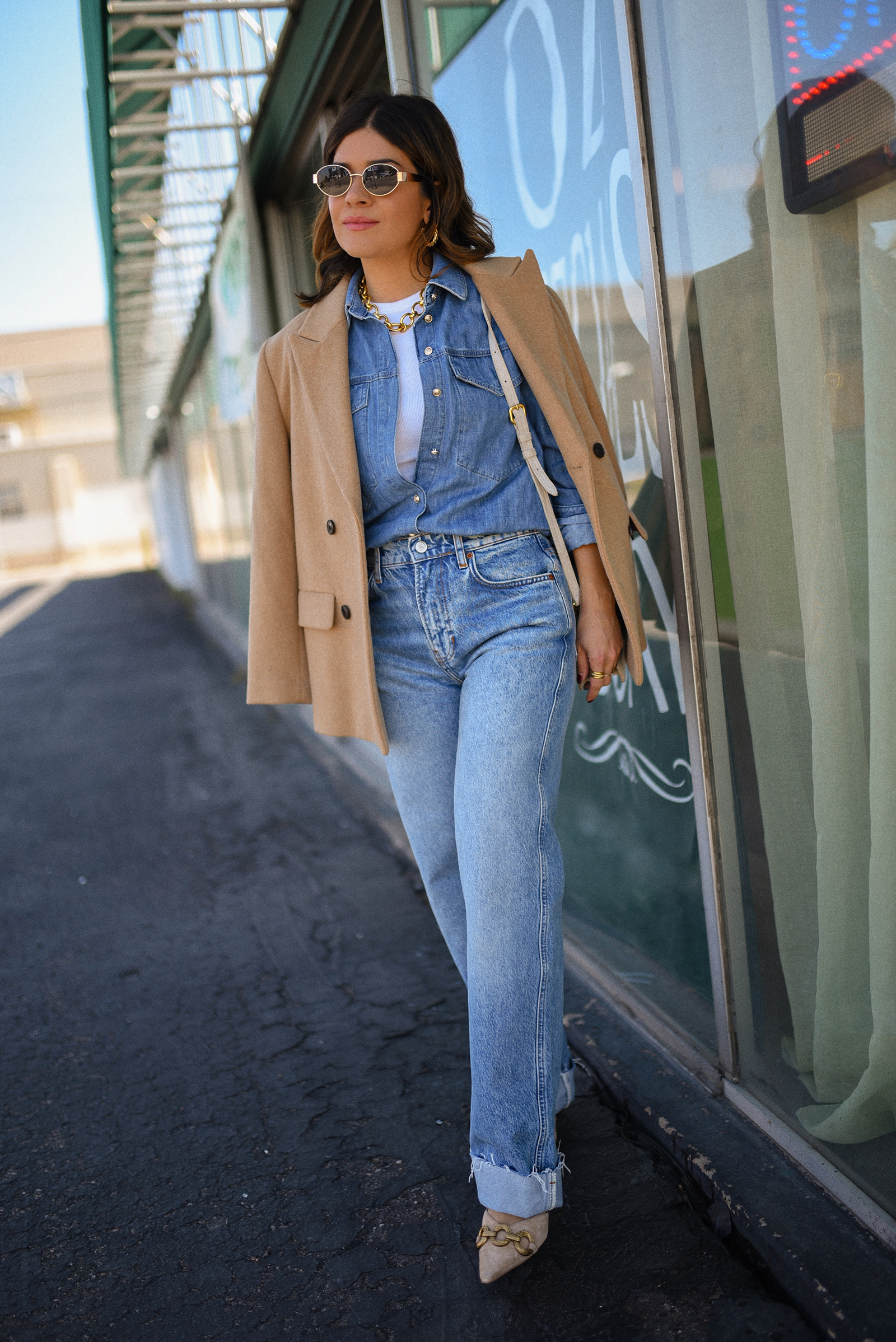 Carolina Hellal of Chic Talk wearing a denim on denim look, shirt via Sezane, wide leg jean from Nordstrom, tank top via Target, Dolce Vita pumps and Jacquemus bag