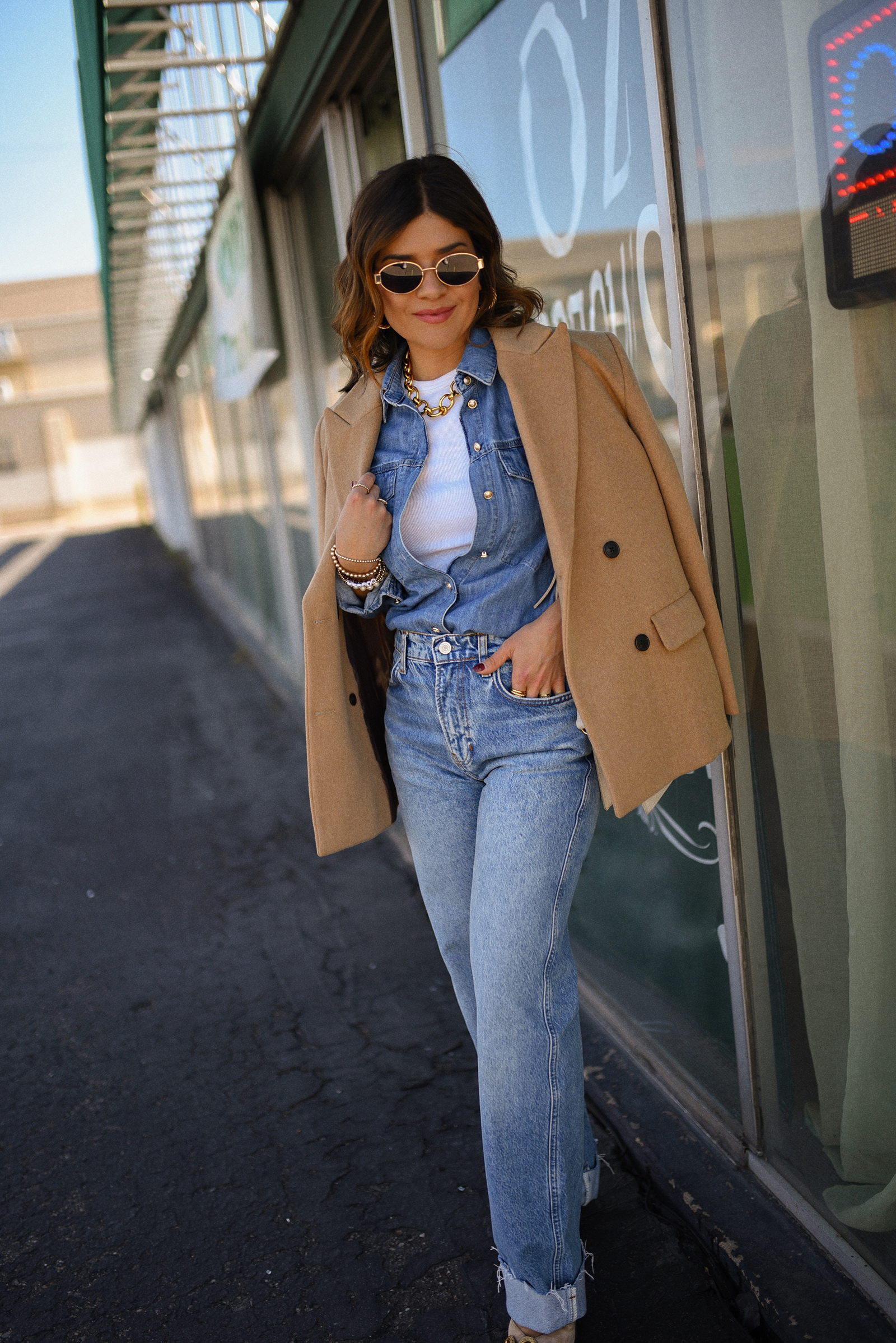 Carolina Hellal of Chic Talk wearing a denim on denim look, shirt via Sezane, wide leg jean from Nordstrom, tank top via Target, Dolce Vita pumps and Jacquemus bag